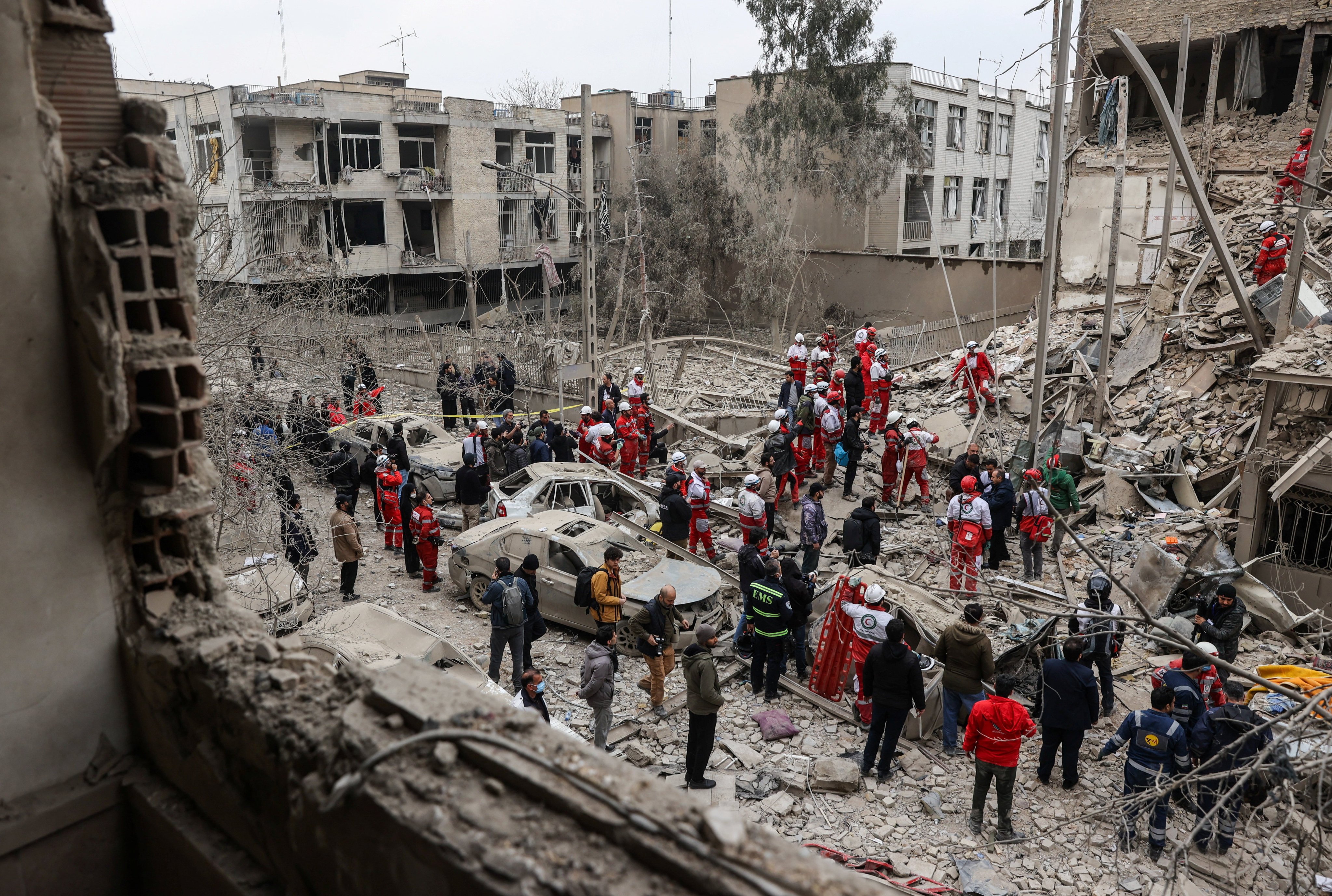 Emergency personnel work at the site of a strike on a residential building, in Tehran on March 16. Photo: via Reuters