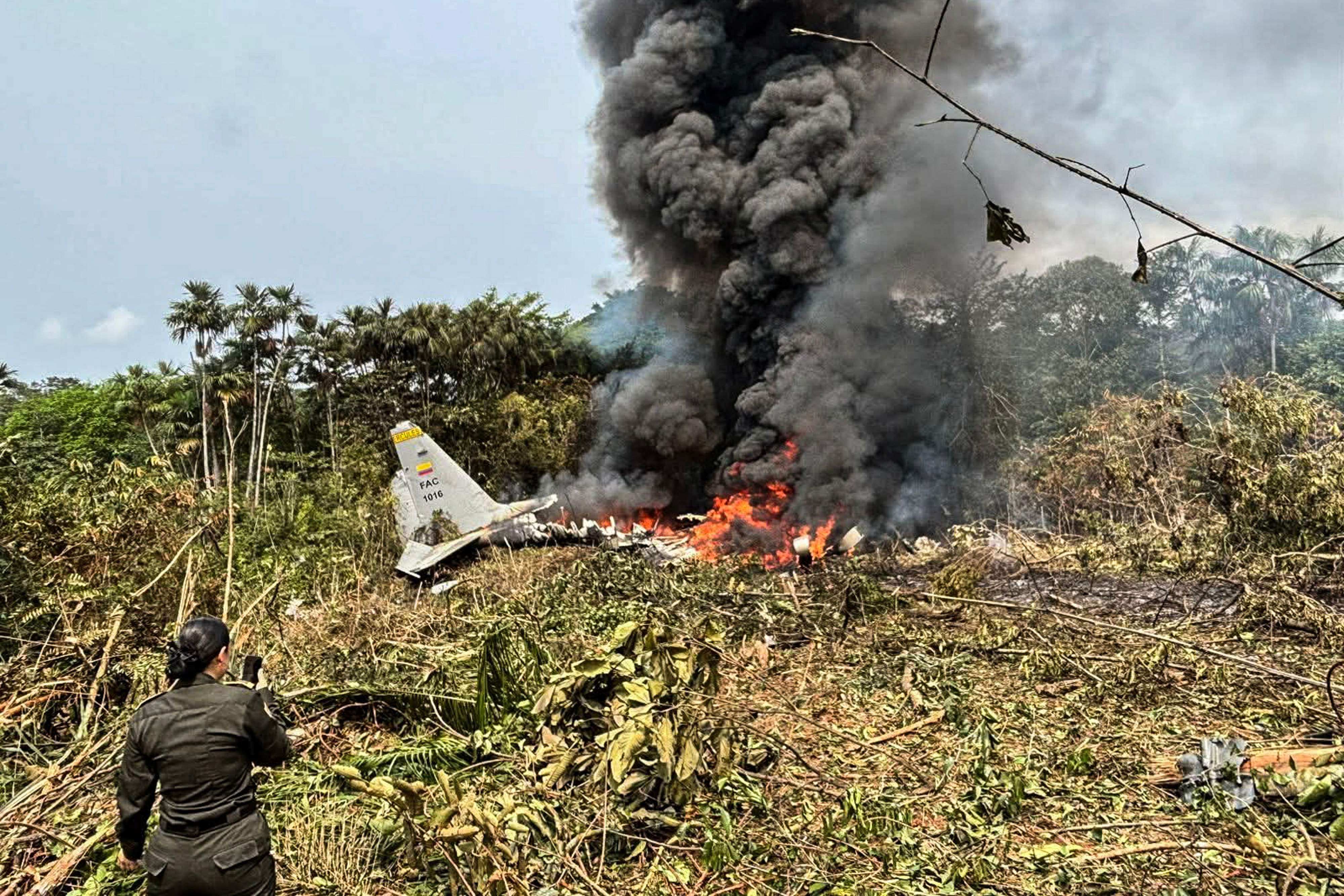 Flames and thick black smoke rise from an Air Force Hercules that crashed during takeoff, in Puerto Leguizamo, Colombia, near the southern border with Ecuador on Monday. Photo: AFP
