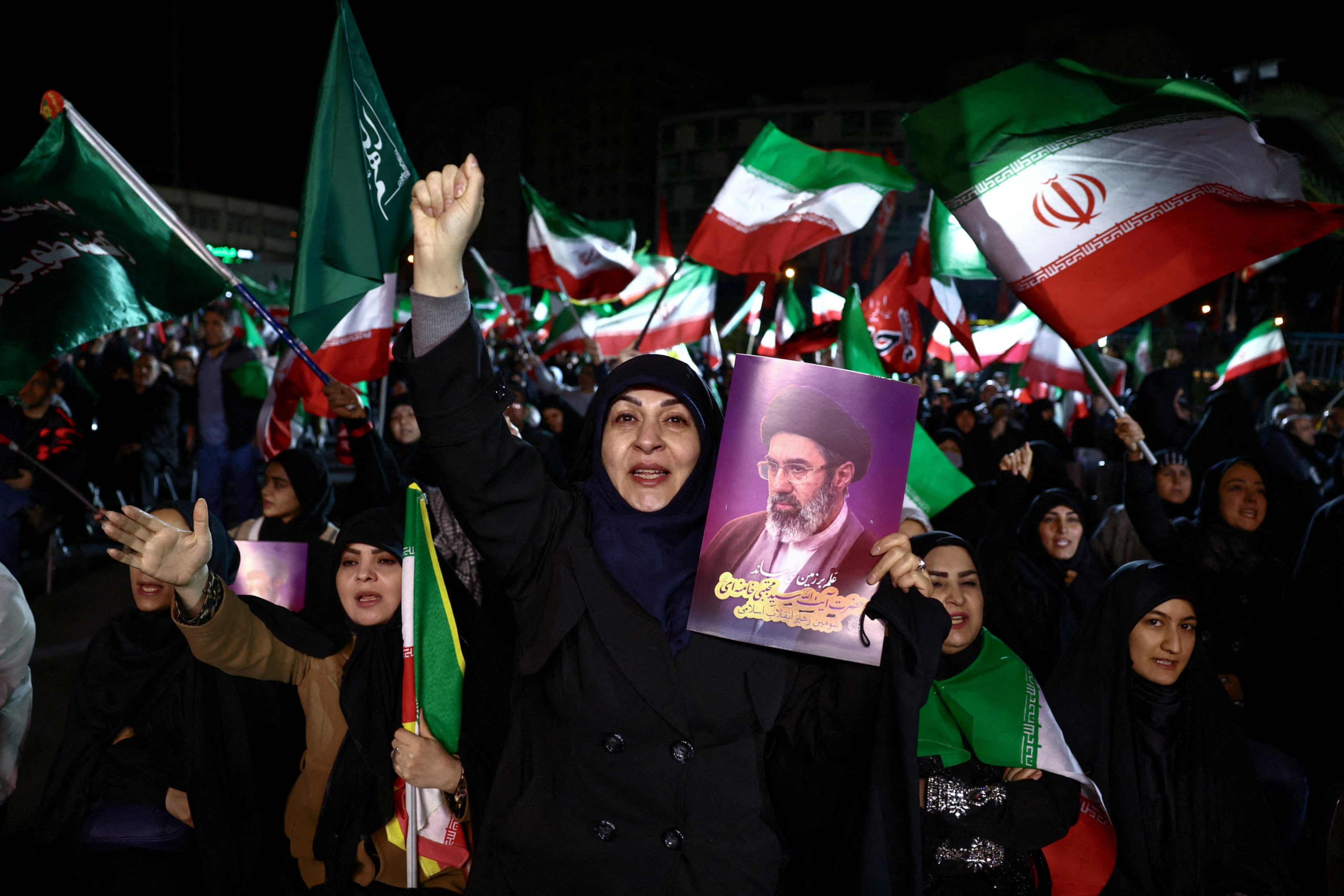 A woman holds a picture of Iran’s Supreme Leader  Mojtaba Khamenei at an anti-US and Israeli rally in Tehran in Sunday. Photo: West Asia News Agency via Reuters