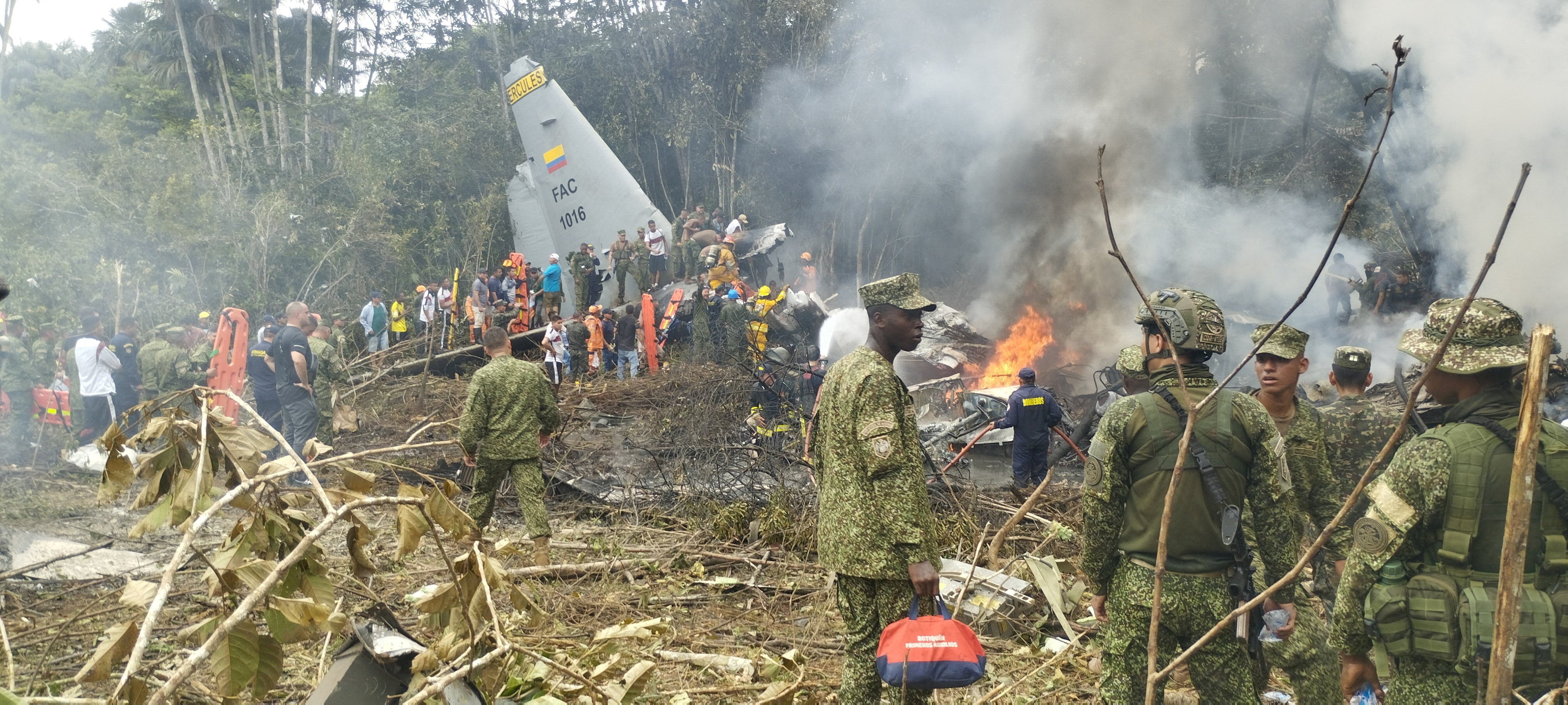 Members of the military at the crash site. Photo: La Voz de Amazonia via Reuters