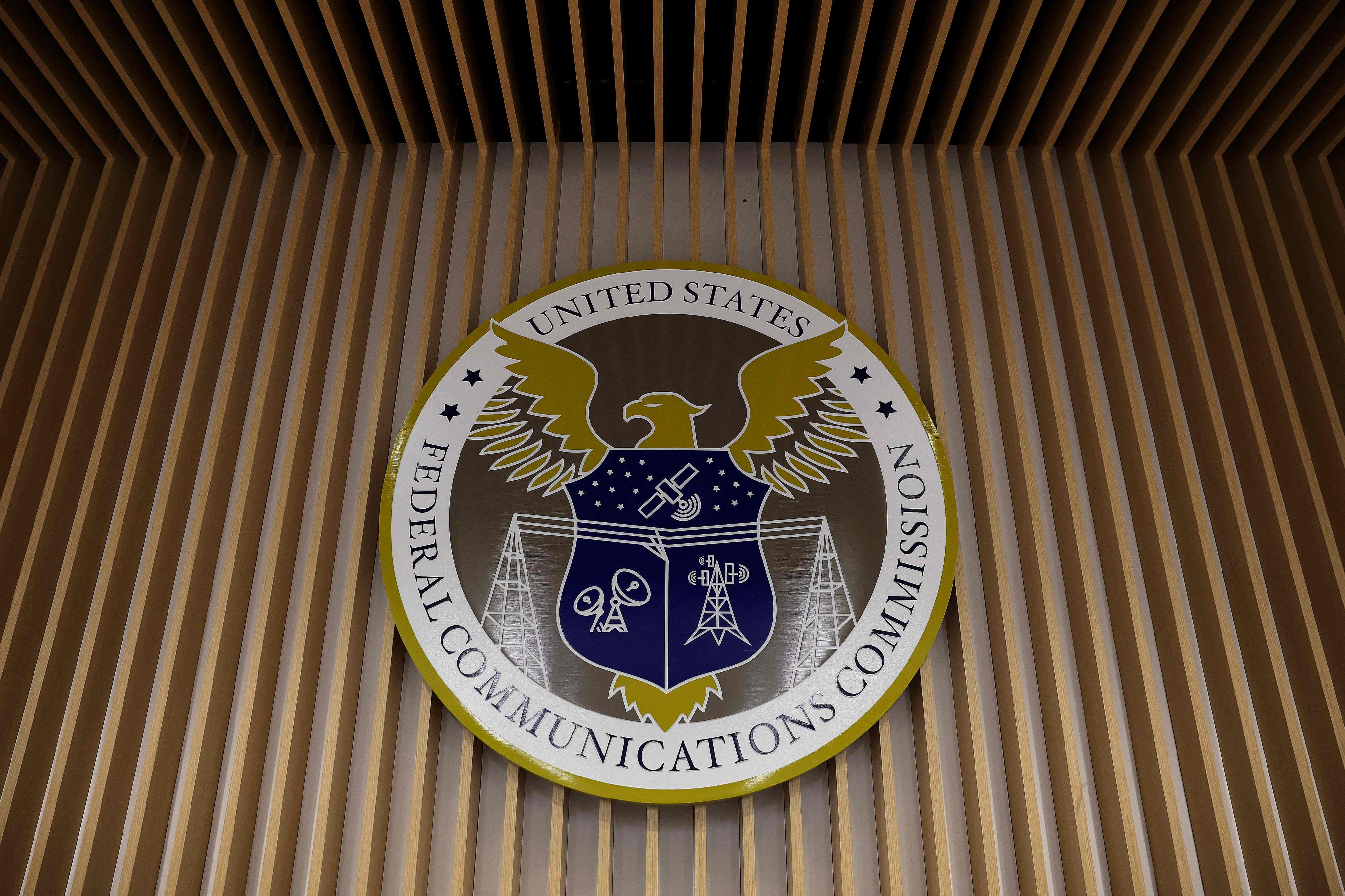 The FCC seal is seen during a meeting at its headquarters in Washington D.C. on February 18, 2026. Photo: Getty Images via AFP