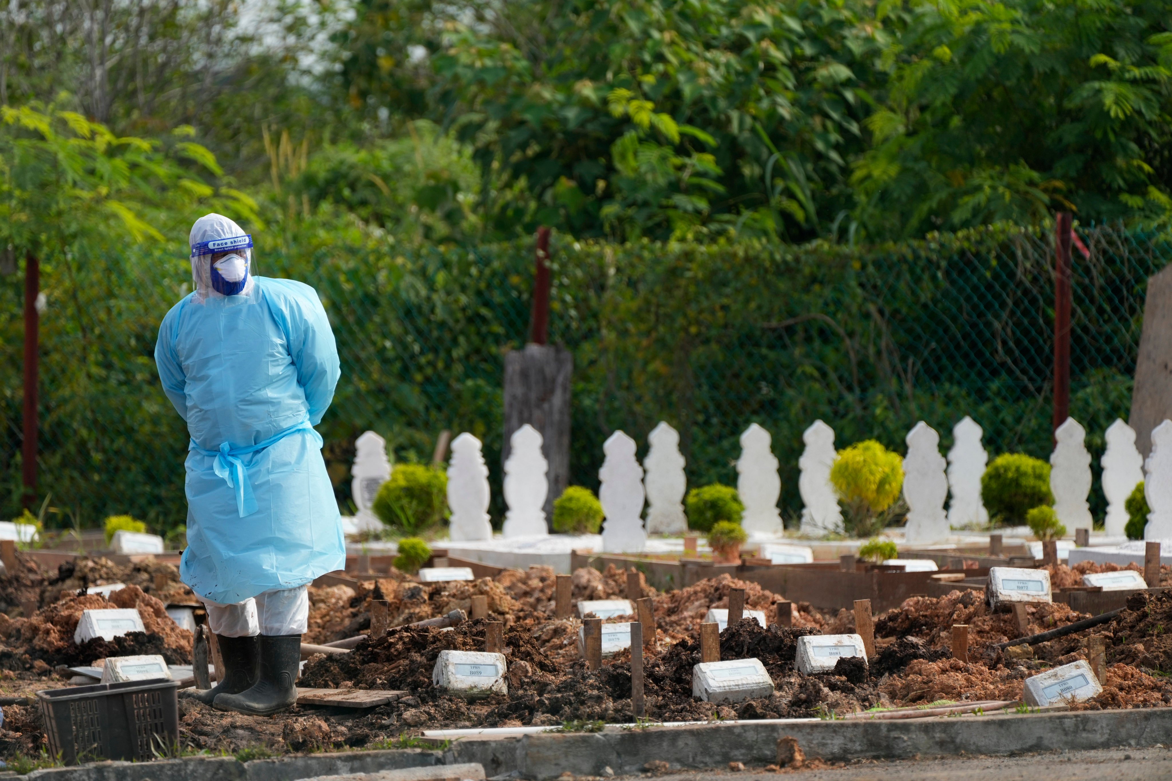 A couple’s intimate moment at a Malaysian cemetery was caught on camera, sparking outrage. Photo: AP