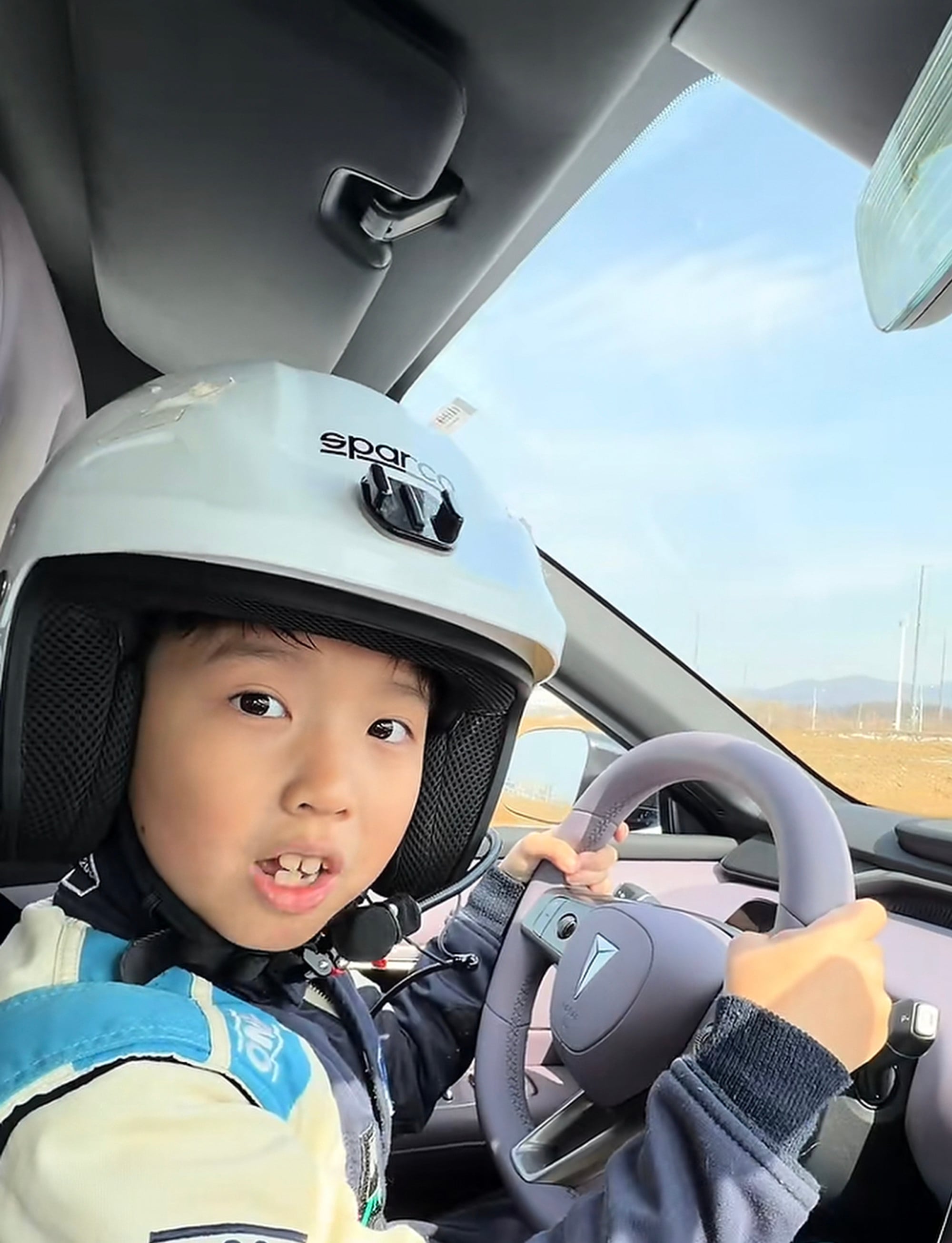 Ready to go: Shao looking confident behind the wheel of a real vehicle. Photo: Douyin