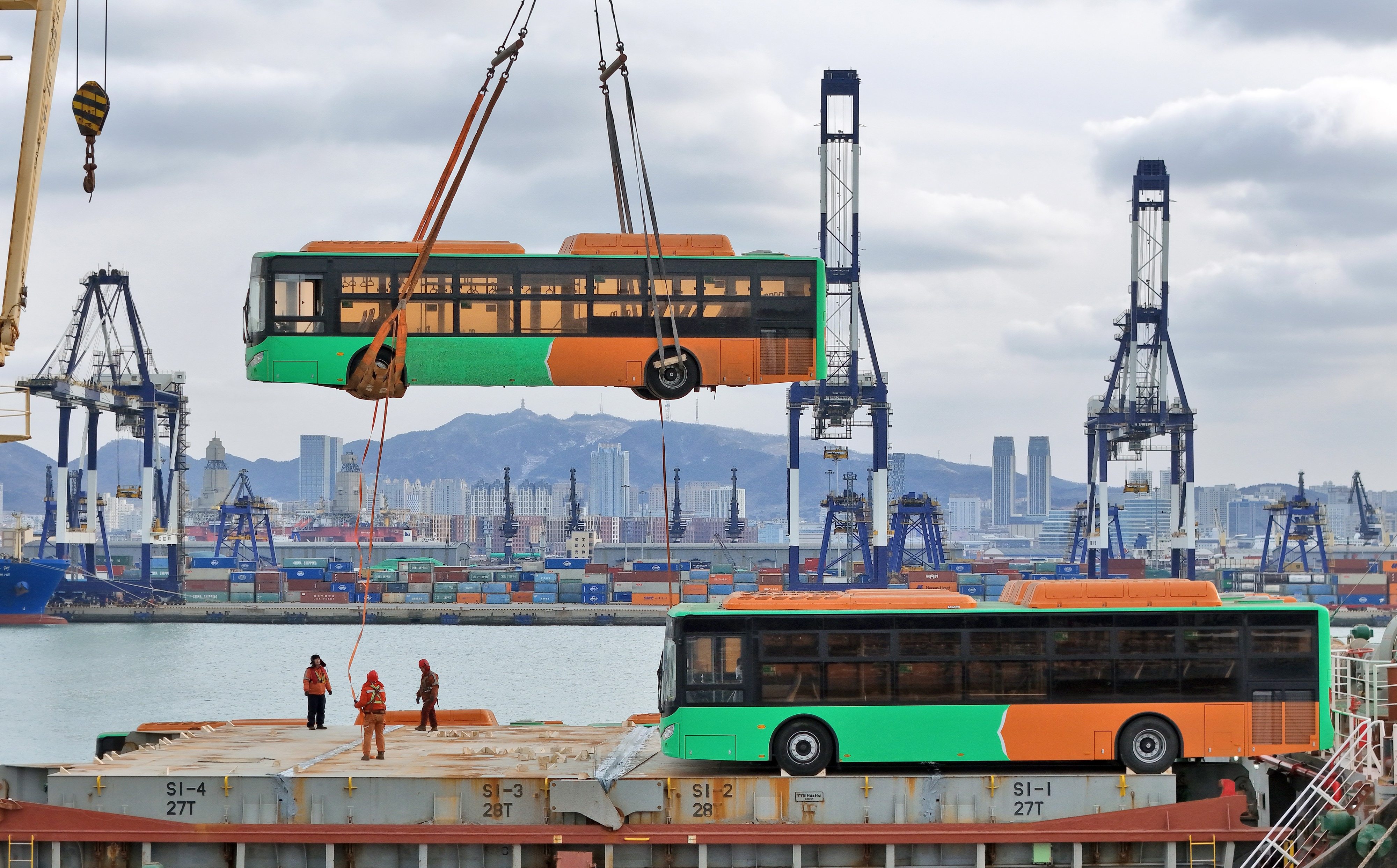 Natural gas-powered buses bound for Mexico are loaded onto a ship at Yantai Port in east China’s Shandong province. Photo: Xinhua