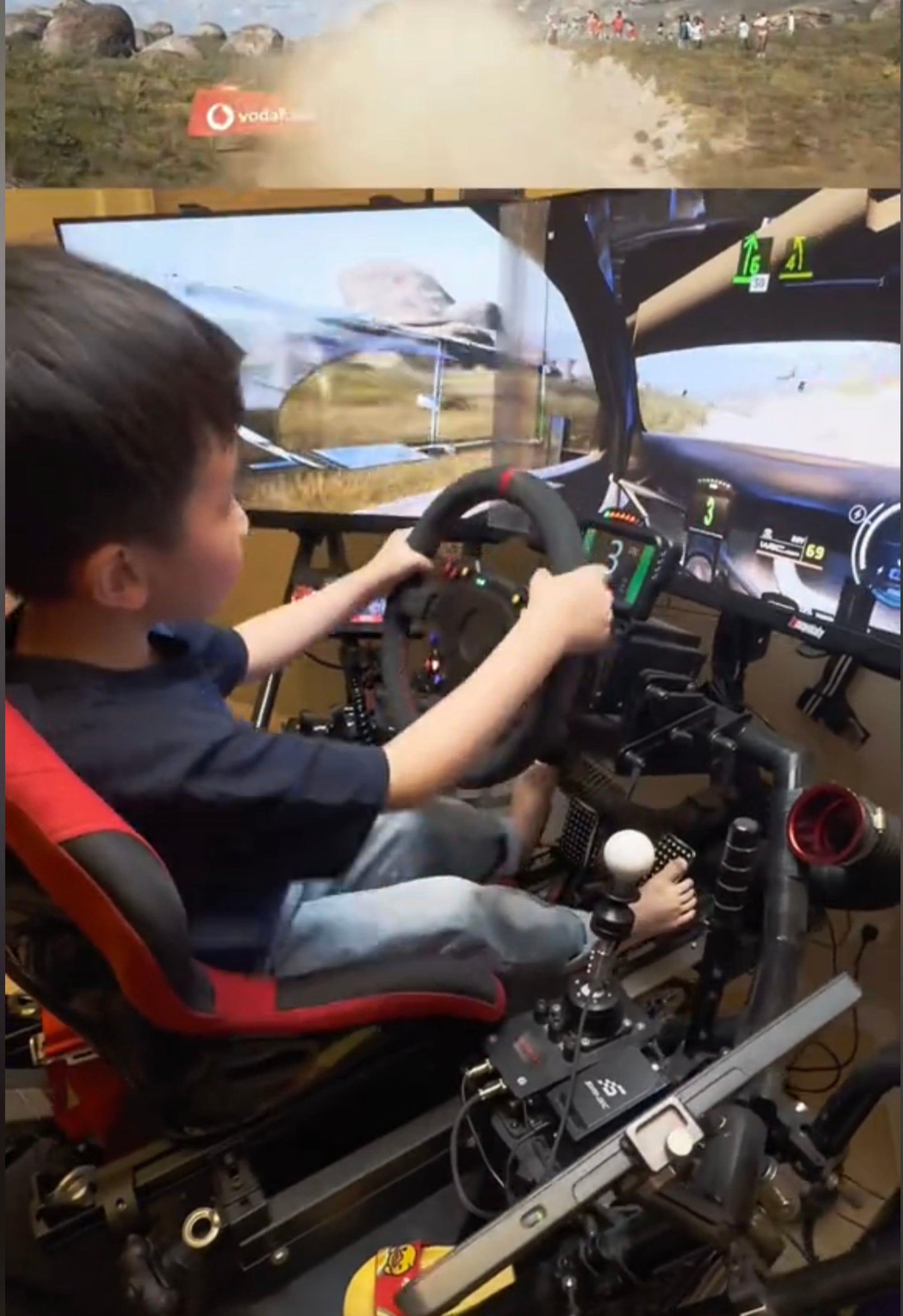 Shao Ziyan’s feet only just reach the pedals on the simulator where he began his journey. Photo: Douyin