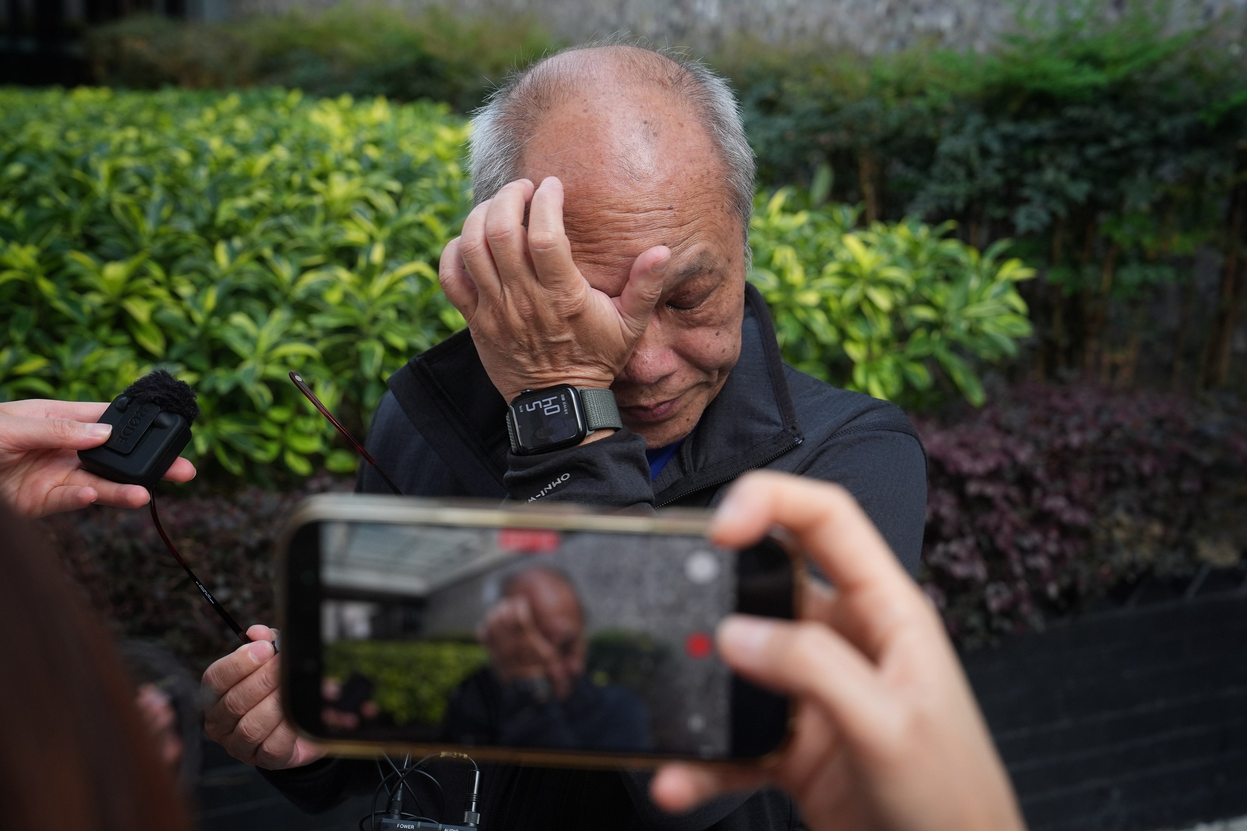Resident Mr Yip weeps during the interview after attending the first day of the public inquiry hearing of the deadly fire of Wang Fuk Court in Tai Po. 19MAR26 SCMP / Elson Li