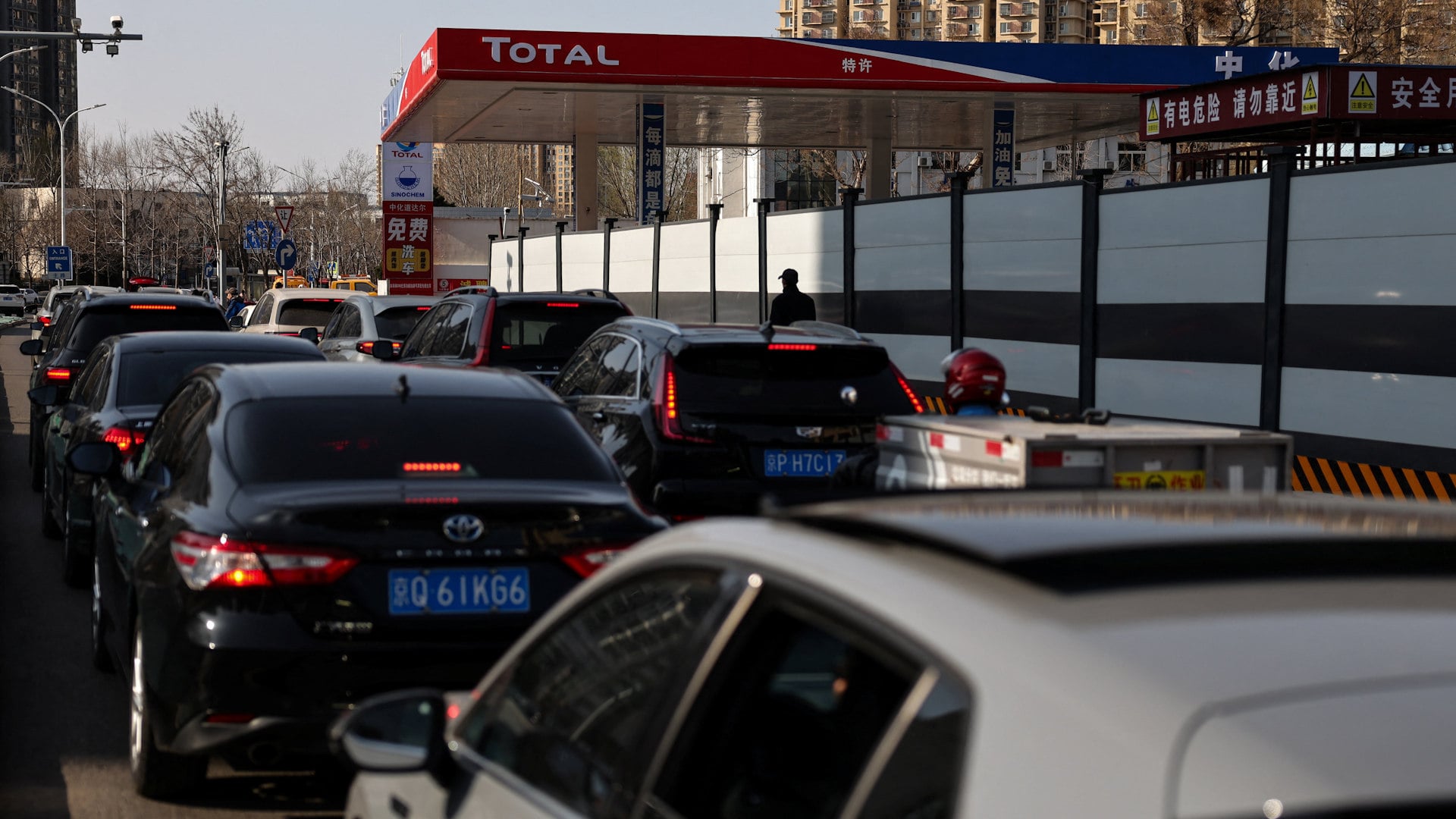 Businesses contend with soaring energy, raw material and freight costs, while Chinese consumers queue at petrol stations amid price hike fears.