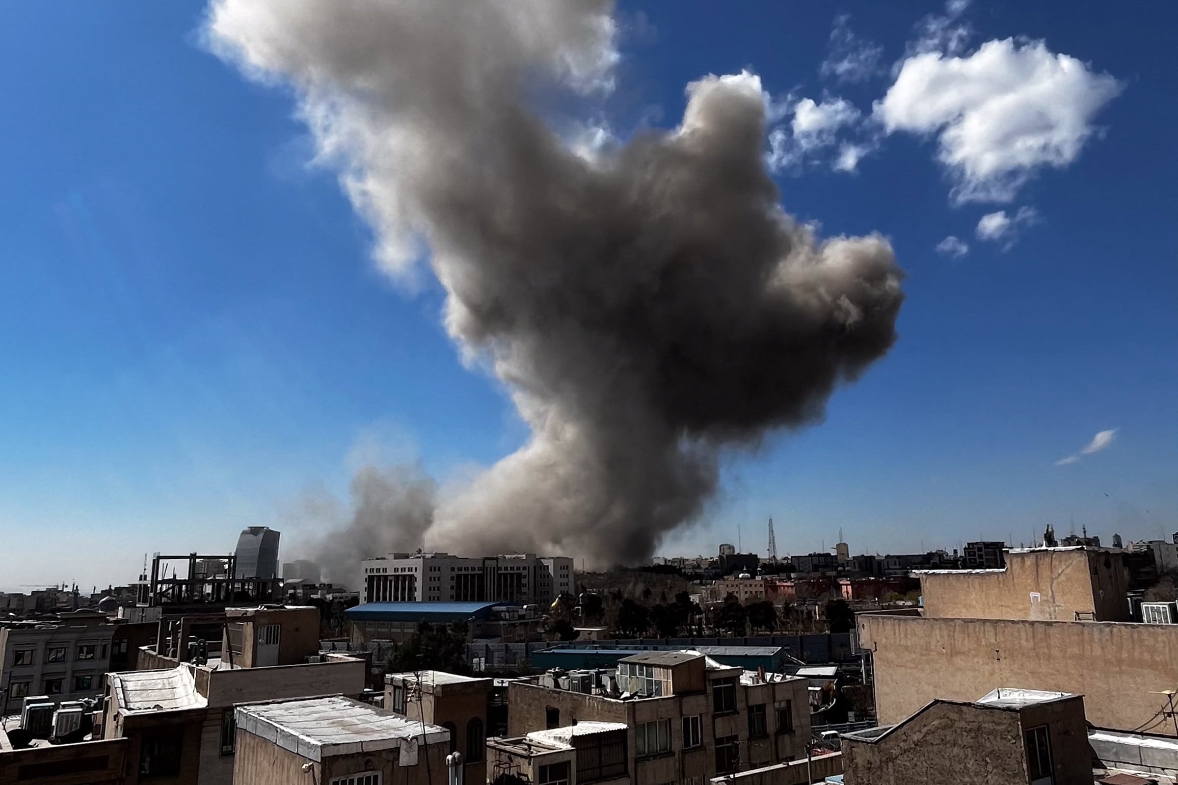 Plumes of smoke rise following reported explosions close to Sepah Square in Tehran on March 1 amid the ongoing US-Israeli attacks on Iran. Photo: TNS