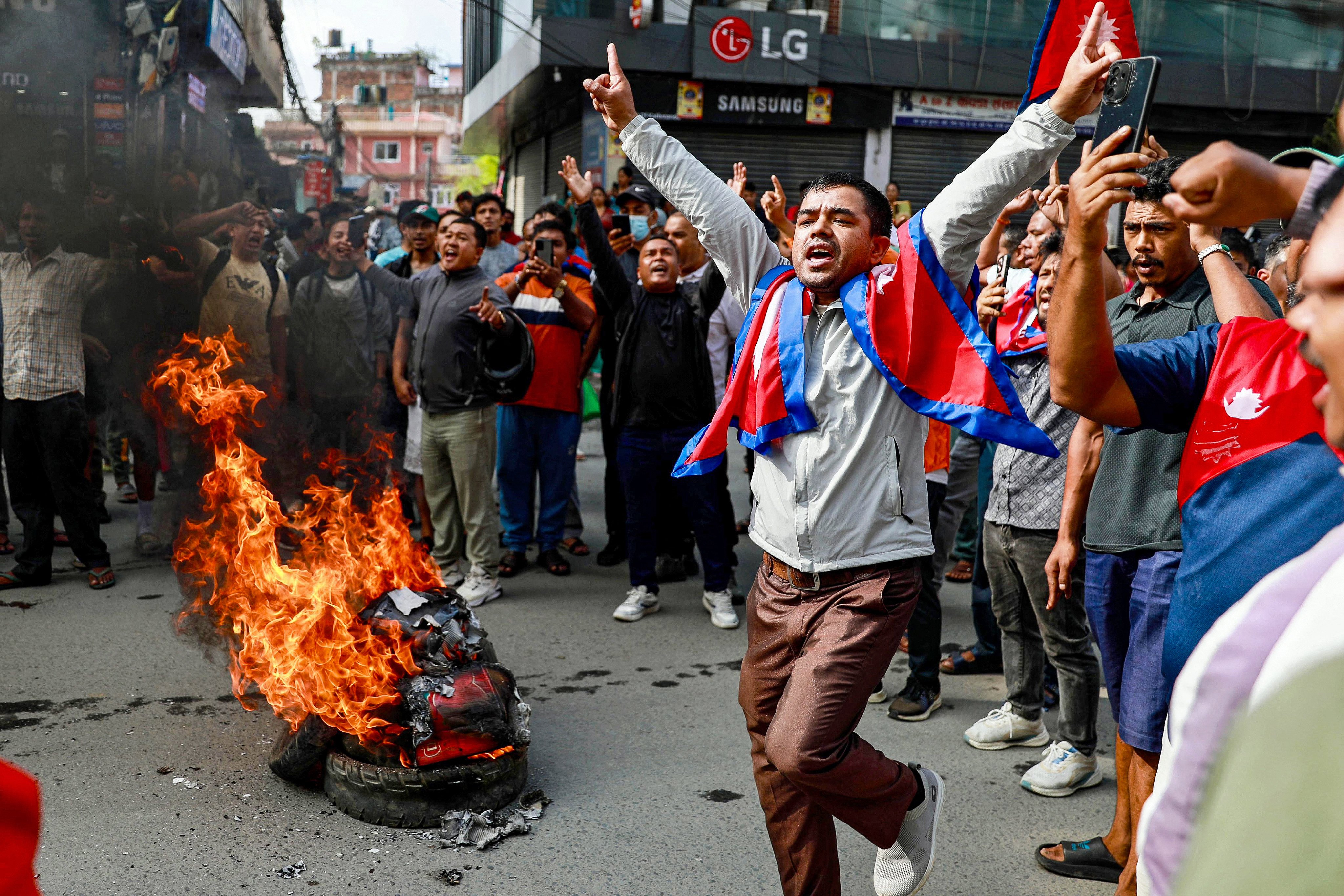 People burn tyres during a demonstration in Kathmandu on September 9 to condemn the Nepali police’s deadly crackdown on protesters. Photo: AFP
