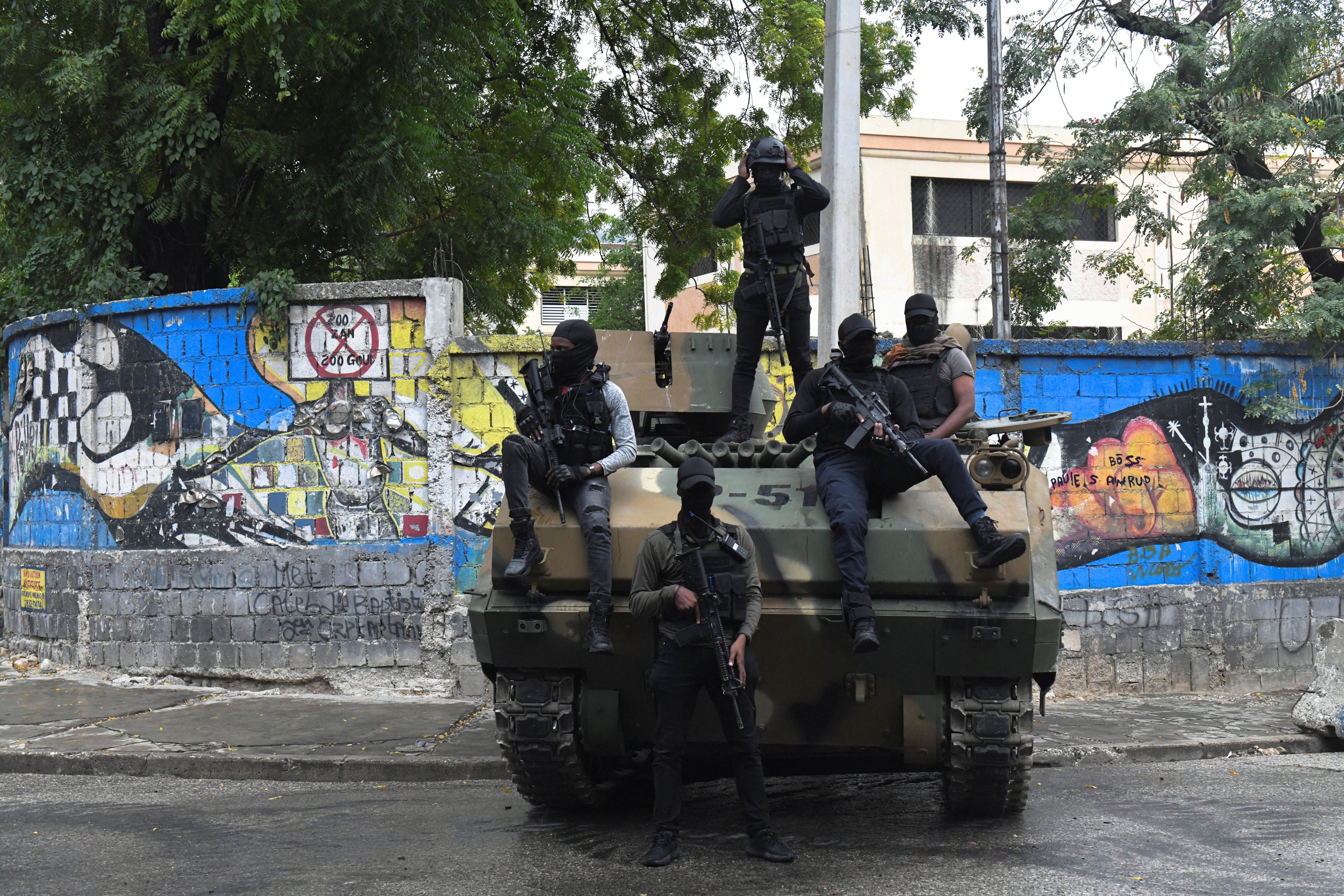 Haitian security forces on an armoured vehicle guard the area near the National Palace in Port‑au‑Prince. Photo: Reuters