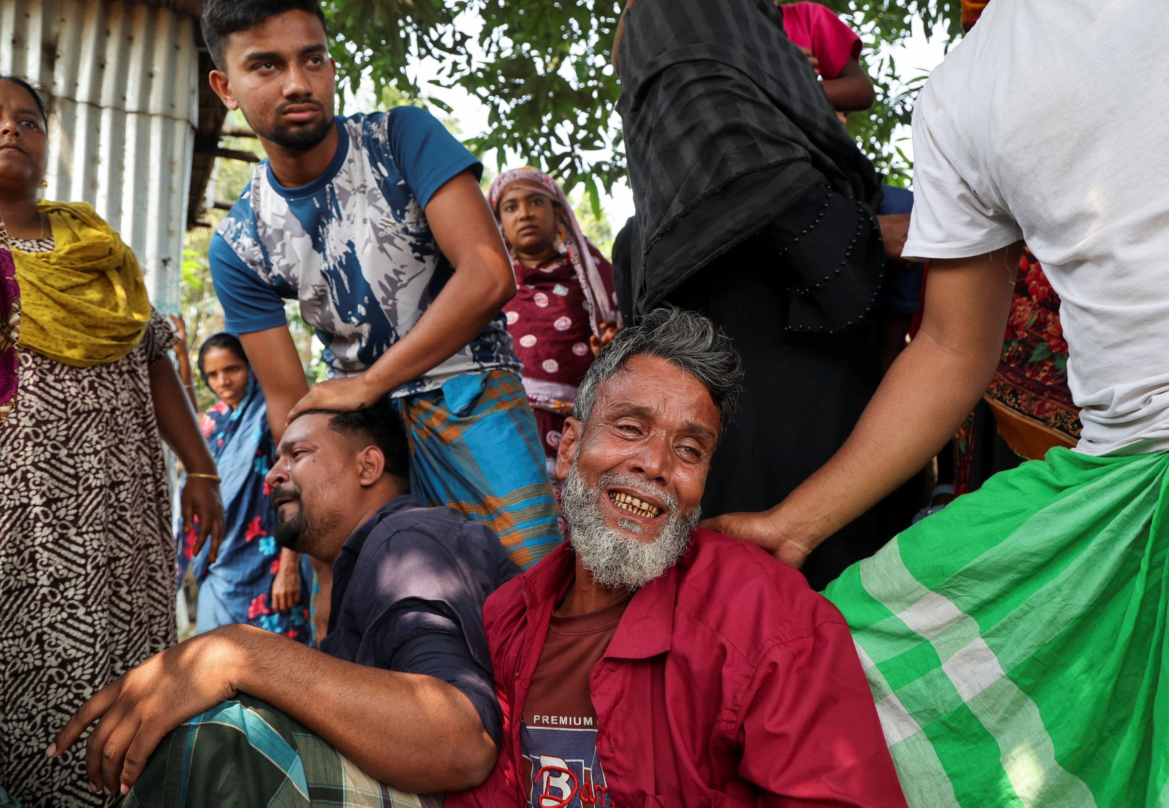 Relatives of a victim mourn after a bus plunged into the Padma River while attempting to board a ferry in Rajbari, Bangladesh on Thursday. Photo: Reuters