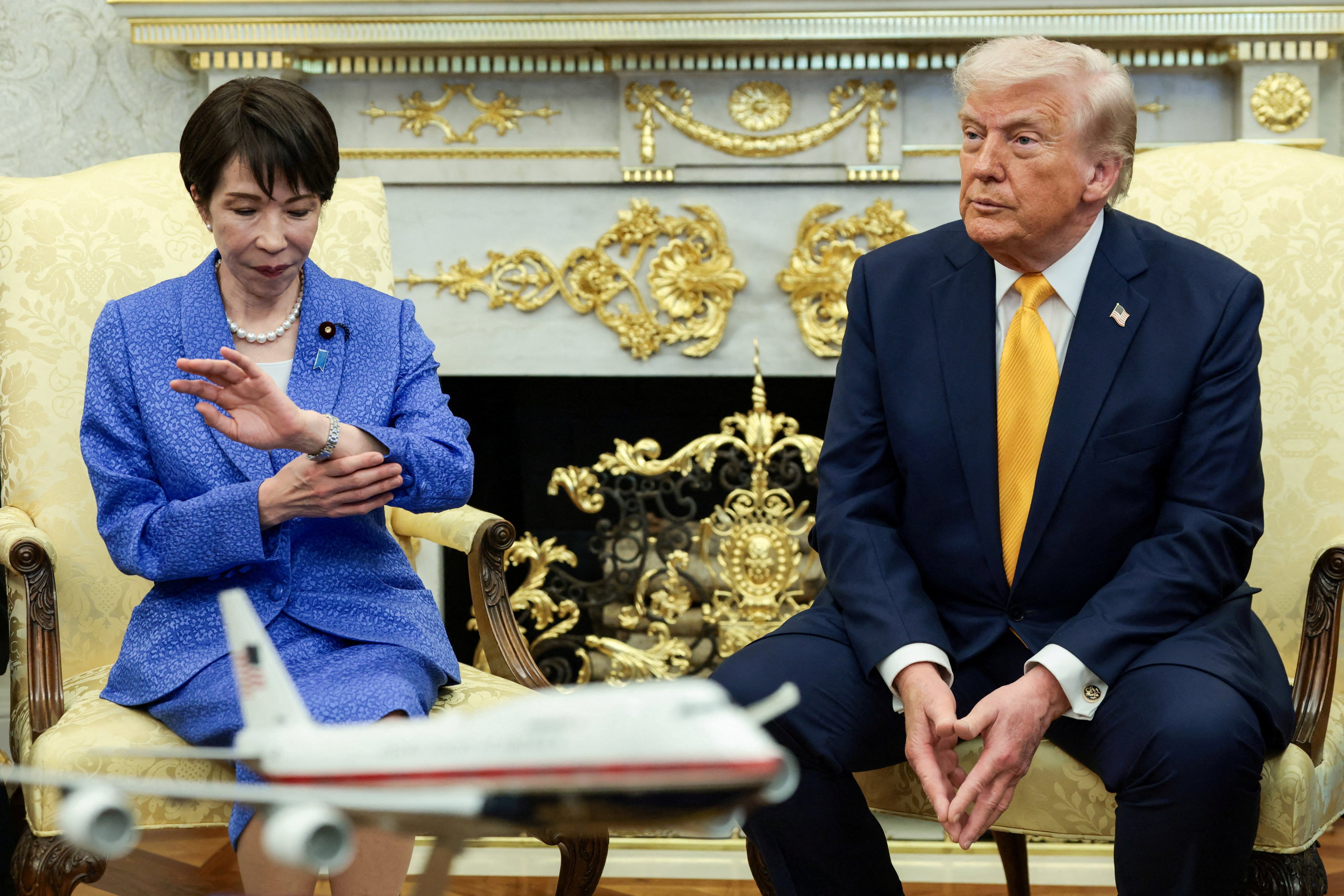 Japanese Prime Minister Sanae Takaichi looks at her watch during a meeting with US President Donald Trump in the Oval Office of the White House in Washington on March 19. Photo: Reuters