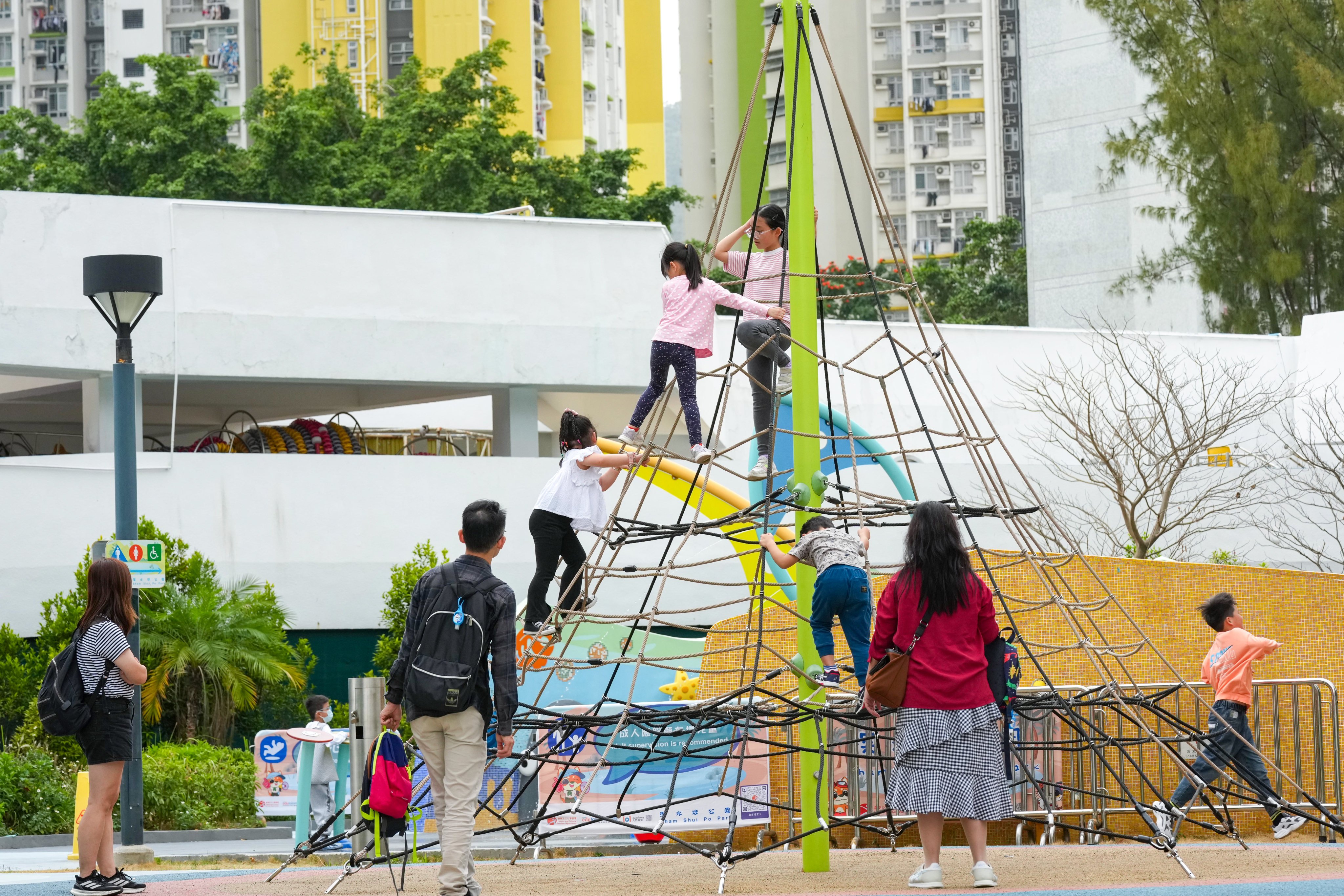 Parents and children at a playground in Sham Shui Po on February 25. Photo: Jelly Tse