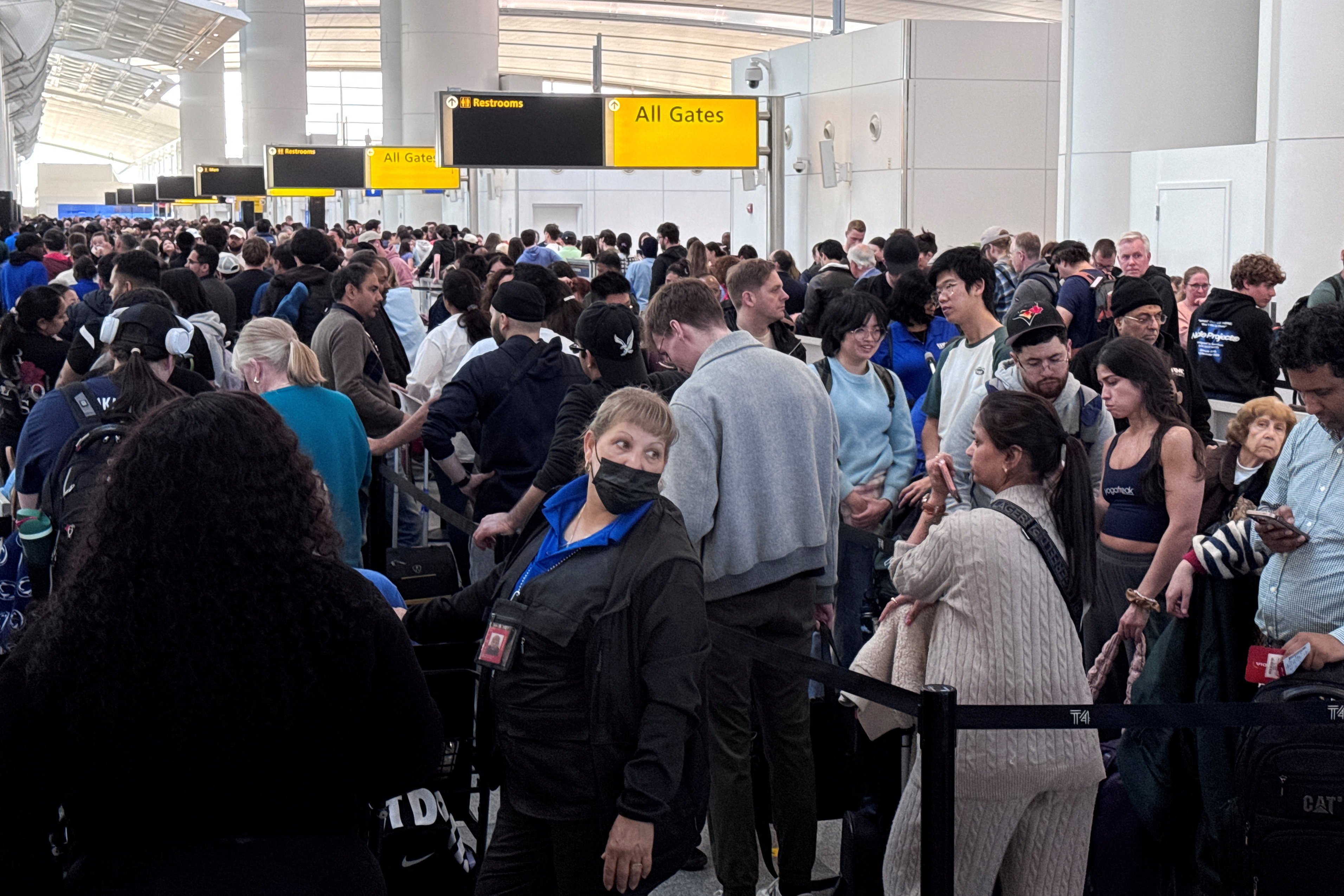 People wait in TSA security queues at New York’s John F. Kennedy International Airport on Thursday. Photo: Reuters