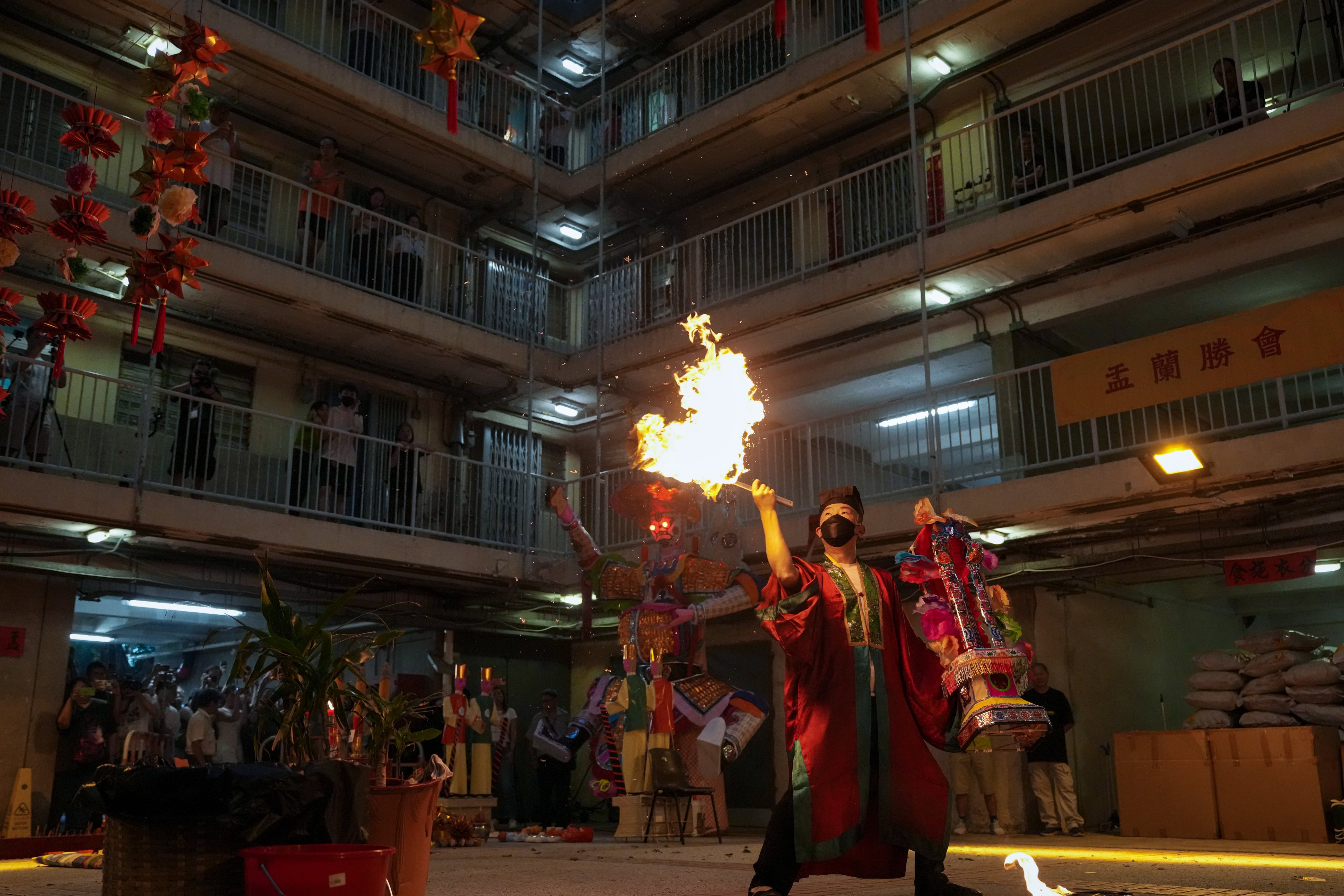 Residents of Wah Fu Estate hold a ritual for the Hungry Ghost Festival to honour their ancestors and comfort wandering spirits in August 2025. It was the last time the festival was held at this location. Photo: Karma Lo
