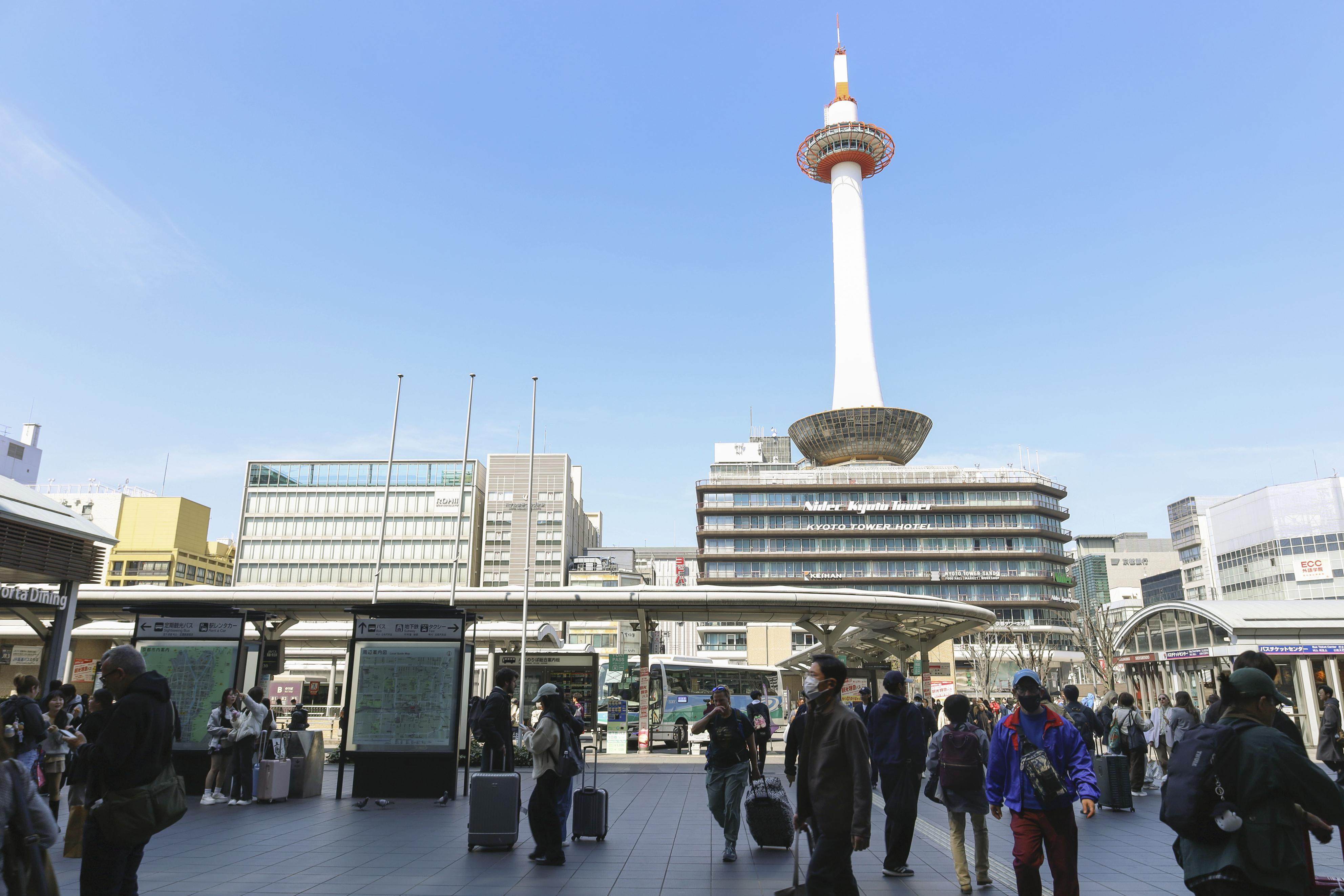 People walk in front of Kyoto Station, Japan. Existing height restrictions limit buildings near the station to a maximum of 31 metres. Photo: Kyodo