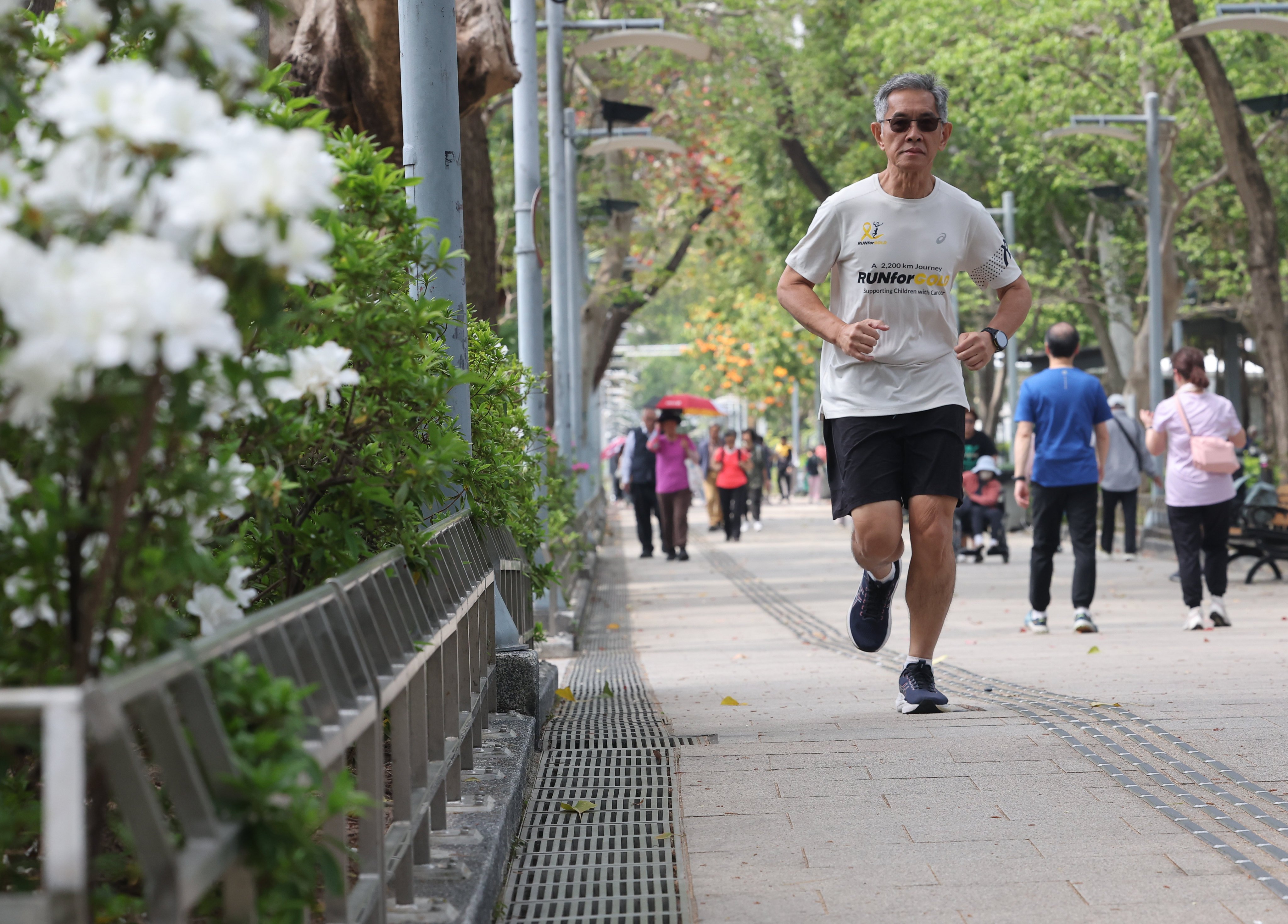 Lim Shyang Guey, a Malaysian runner, at Victoria Park, in Hong Kong. Lim is preparing to run 2,200km around Peninsular Malaysia starting on March 28 in honour of his late wife, who passed away from cancer. Photo: Edmond So