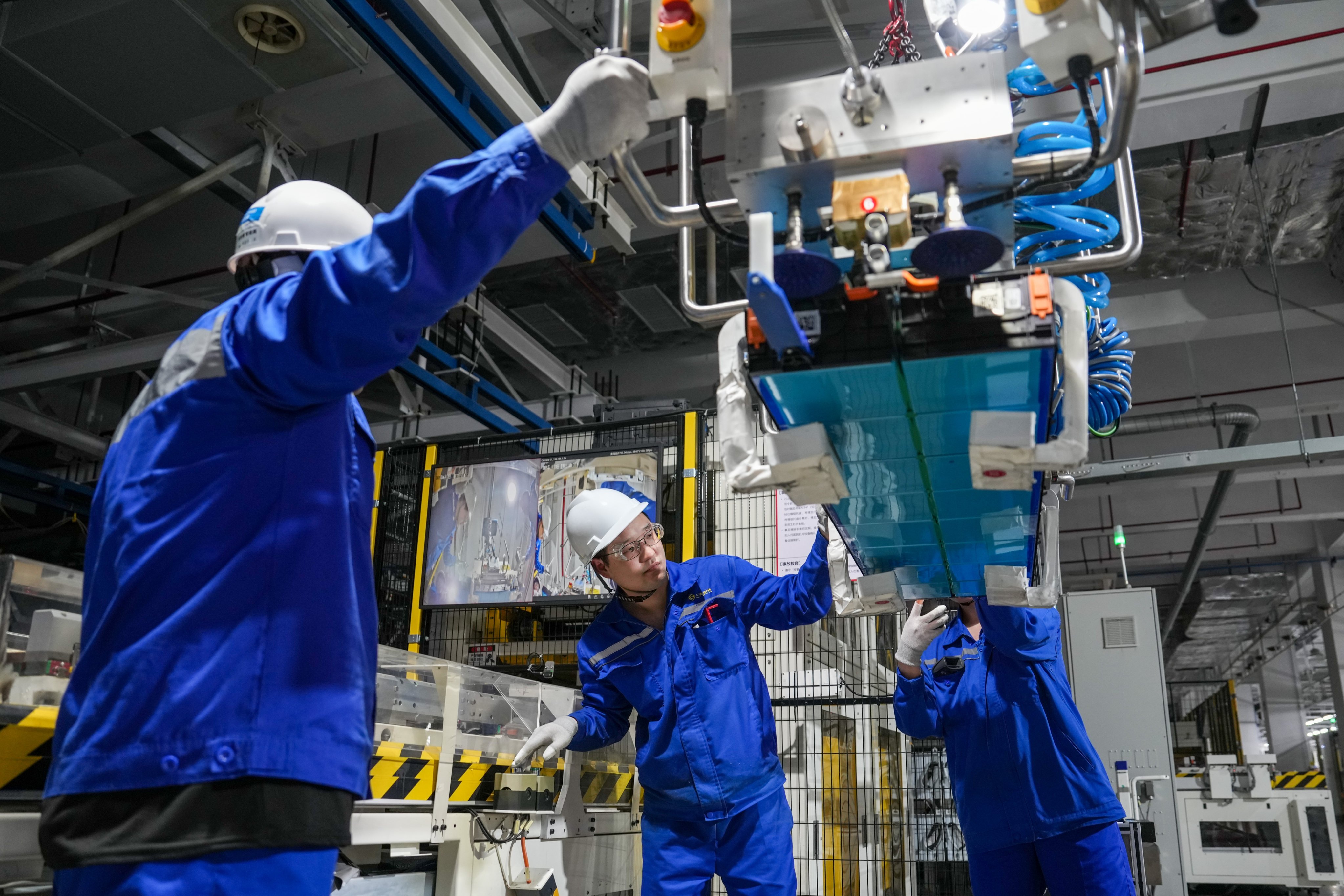 Workers assemble a new energy vehicle battery module in June last year at a factory in Changzhou, Jiangsu province, that was established by battery giant CATL and carmaker SAIC Motor. Photo: Xinhua