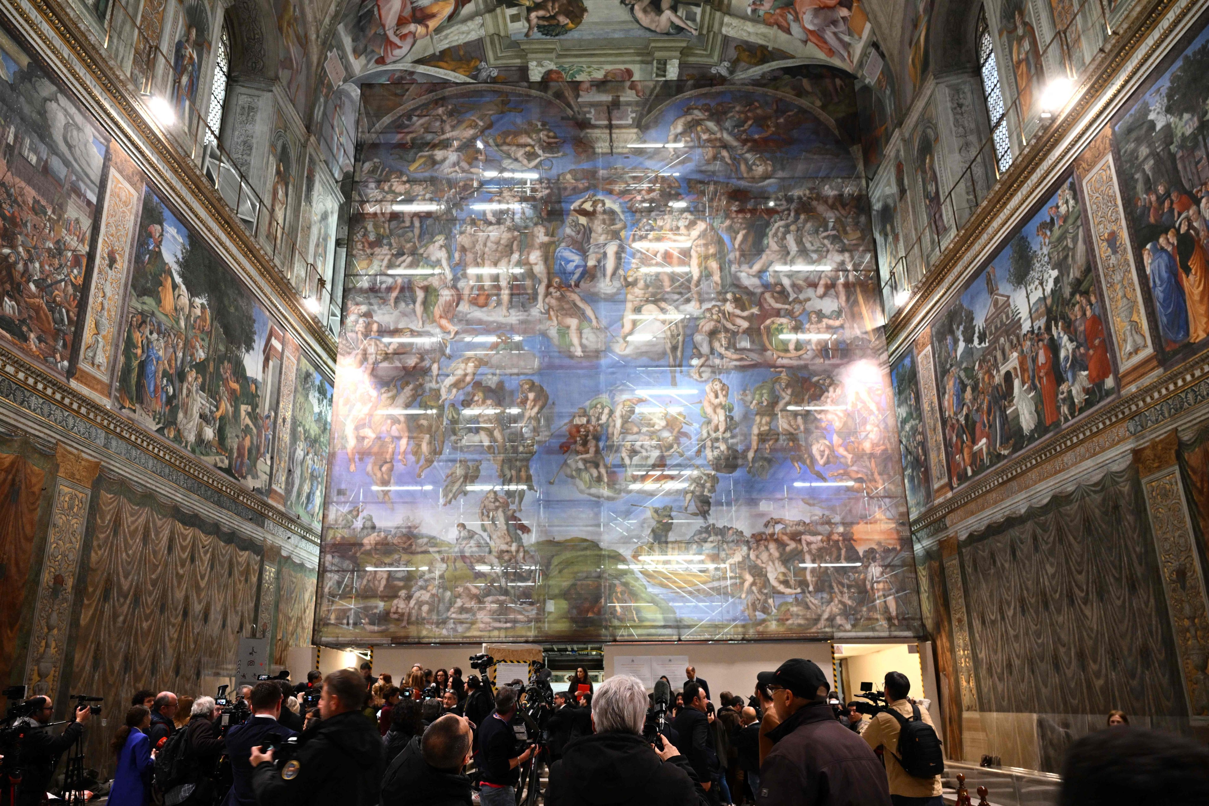 In the Sistine Chapel, the restoration is covered by scaffolding and a replica of of the work. Photo: AFP