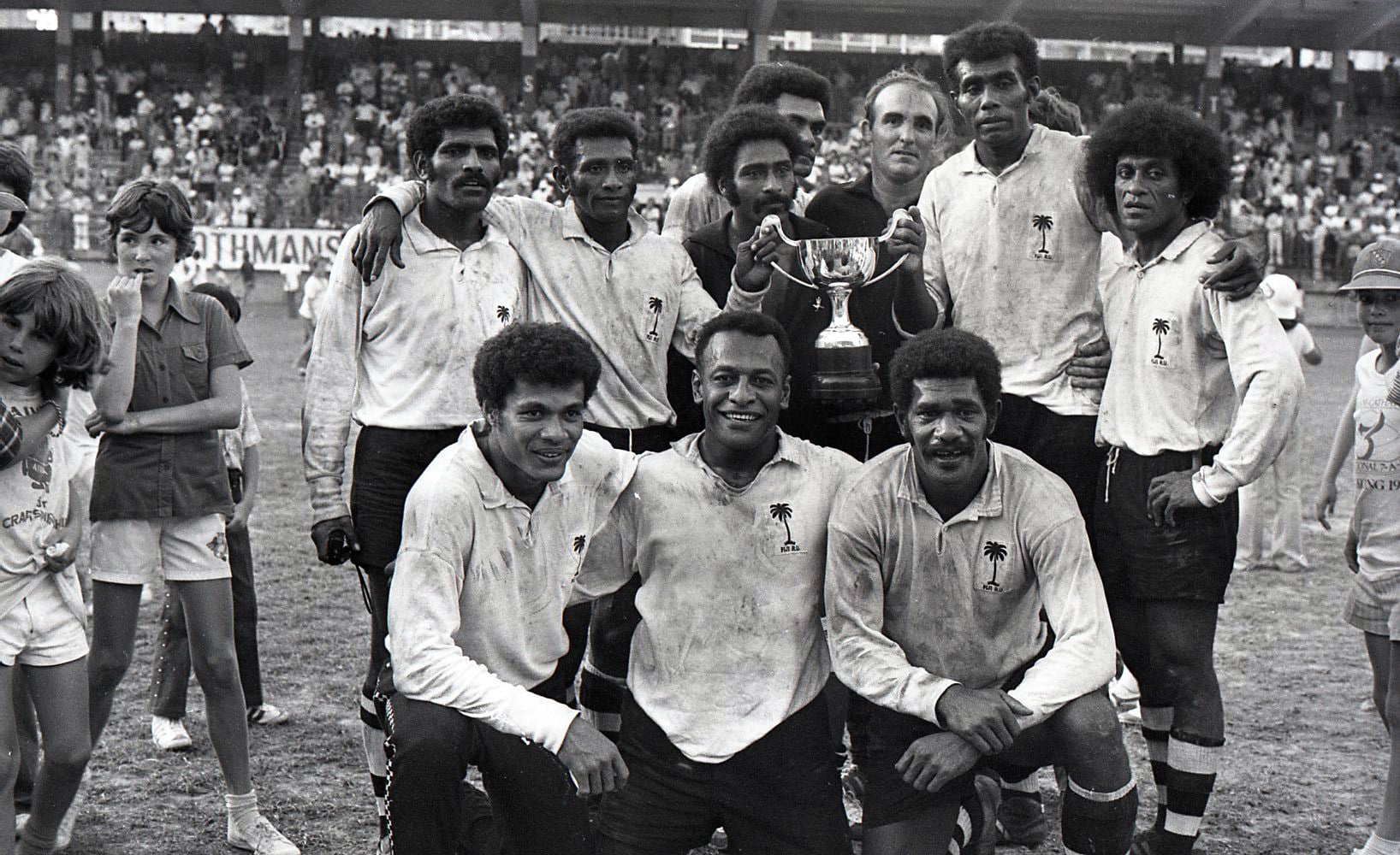 The Fiji team posing with their champions trophy at the Hong Kong Football Club in 1977. Photo: SCMP