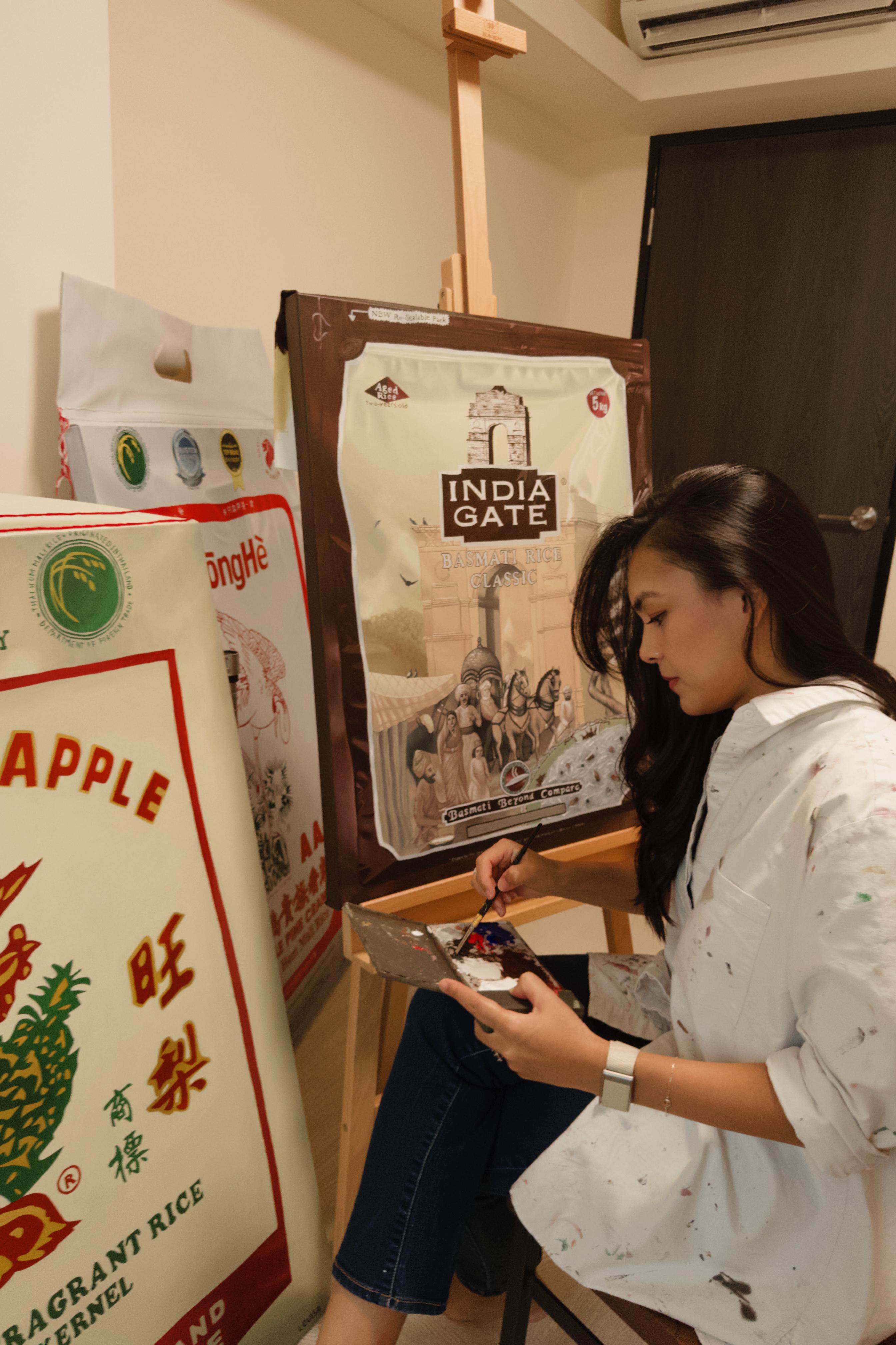 Singaporean artist Louisa Raj prepares for her “Rice is Nice” exhibition. Photo: Handout