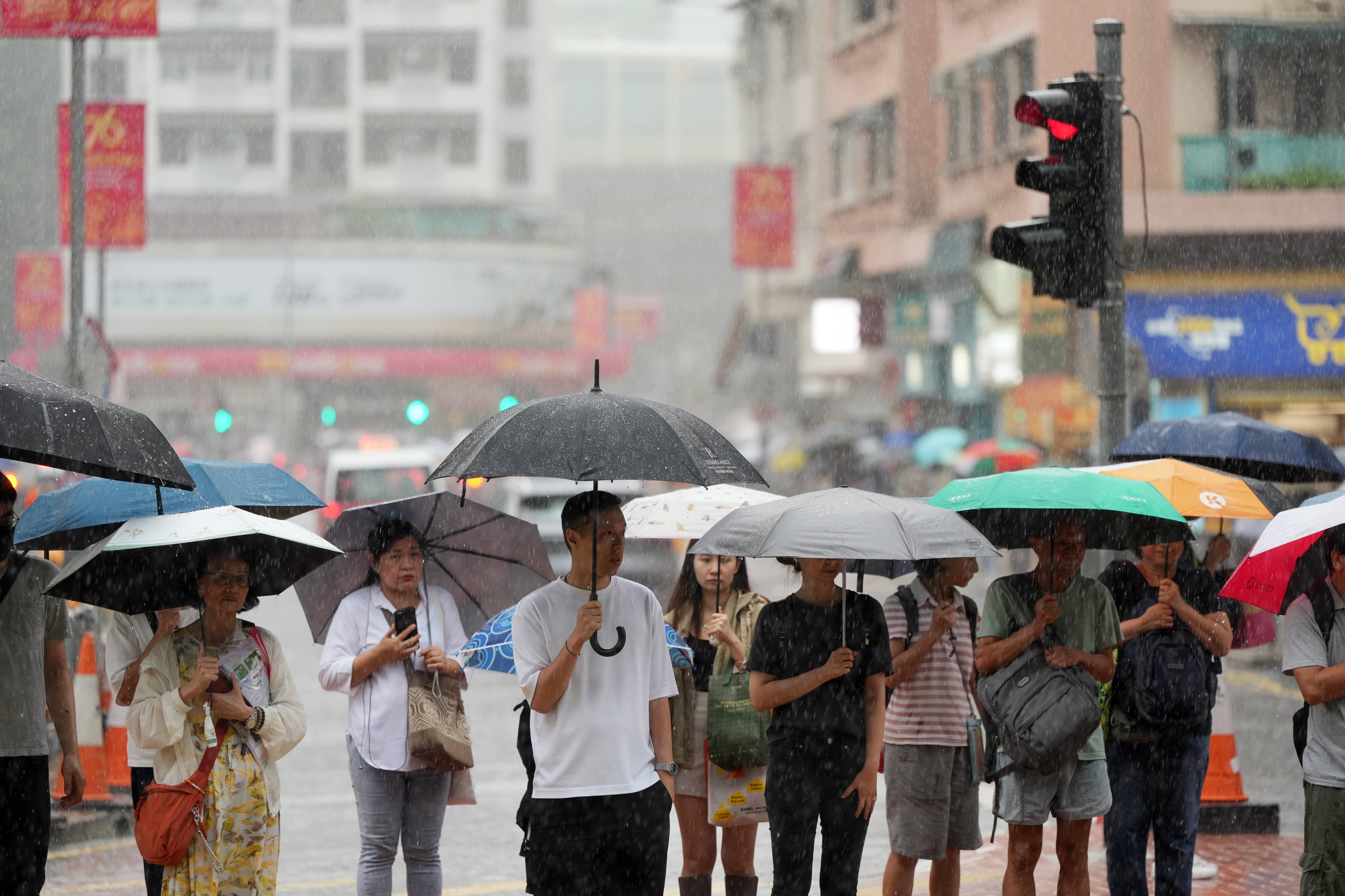 Residents brave the heavy rain last September. Photo: Sam Tsang