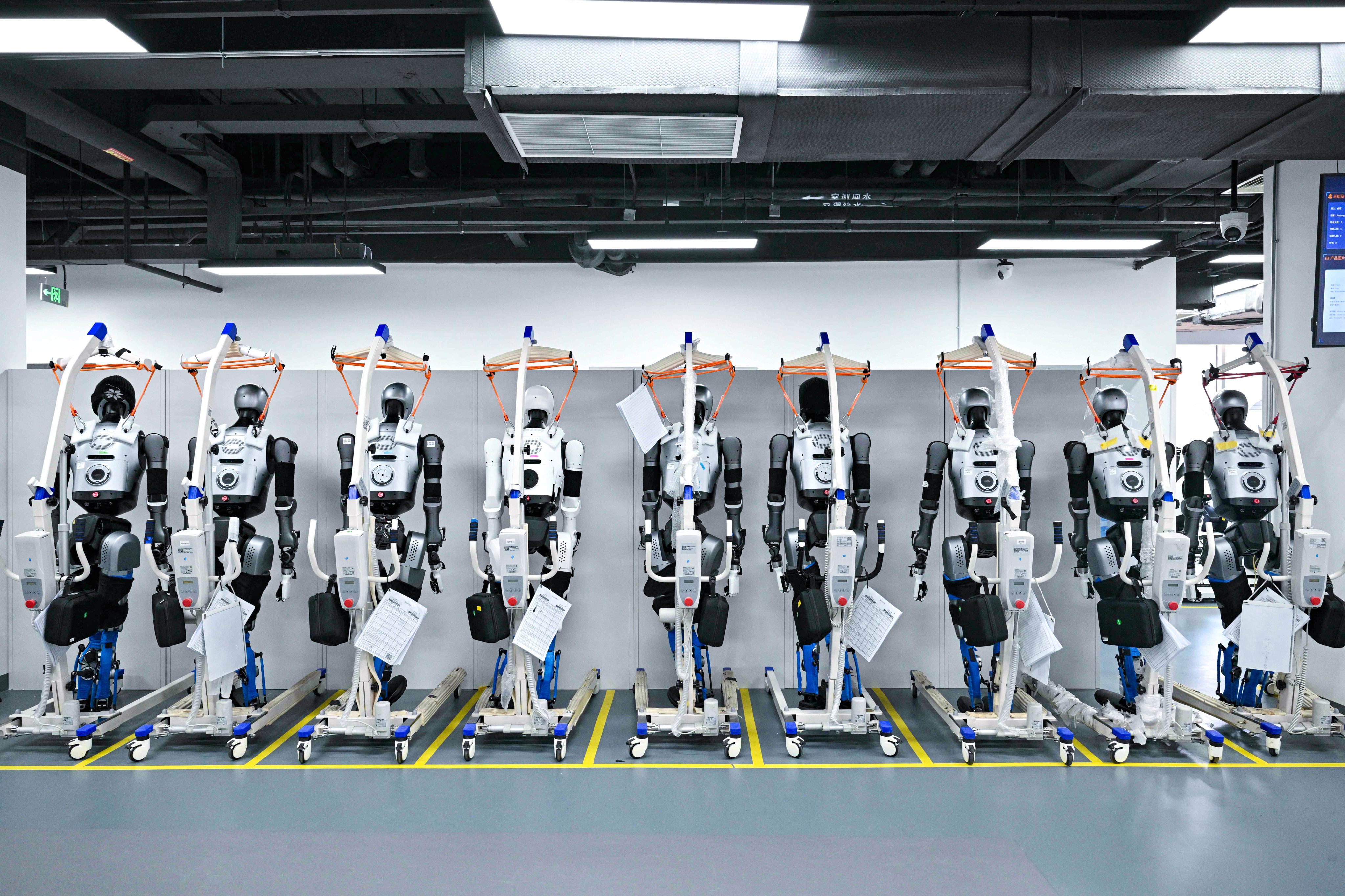 Humanoid robots at the pilot testing and validation platform at the Beijing Innovation Centre of Humanoid Robotics on March 20. Photo: AFP