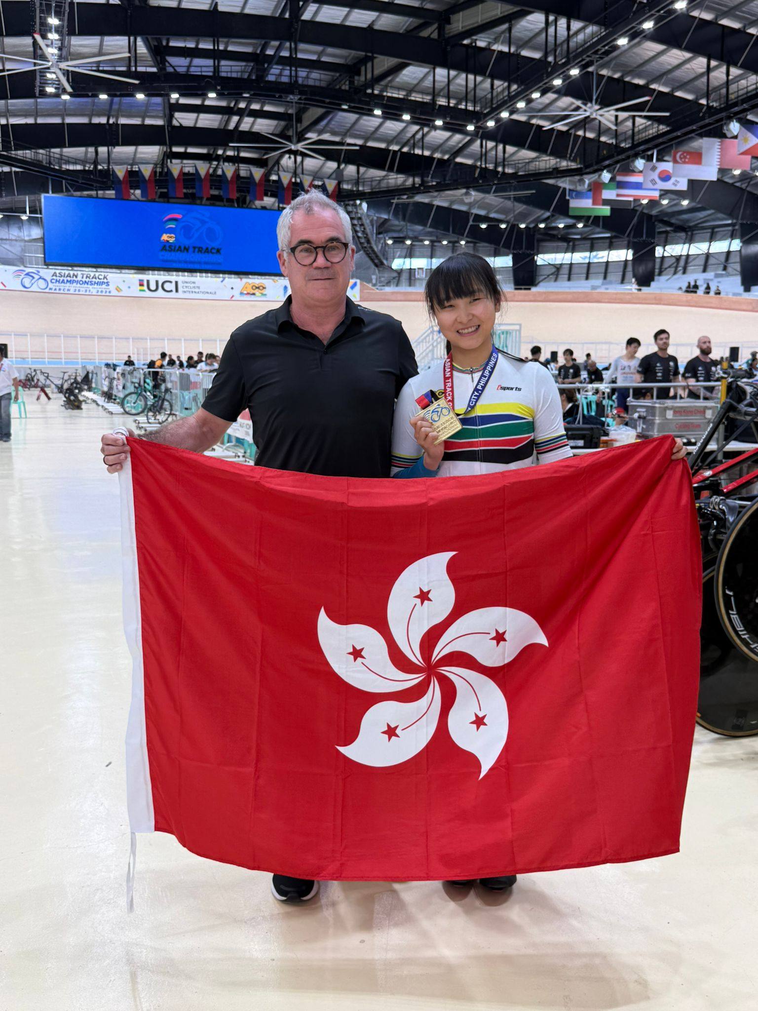 Ceci Lee celebrates her latest success with head coach Herve Dagorne. Photo: CAHKC