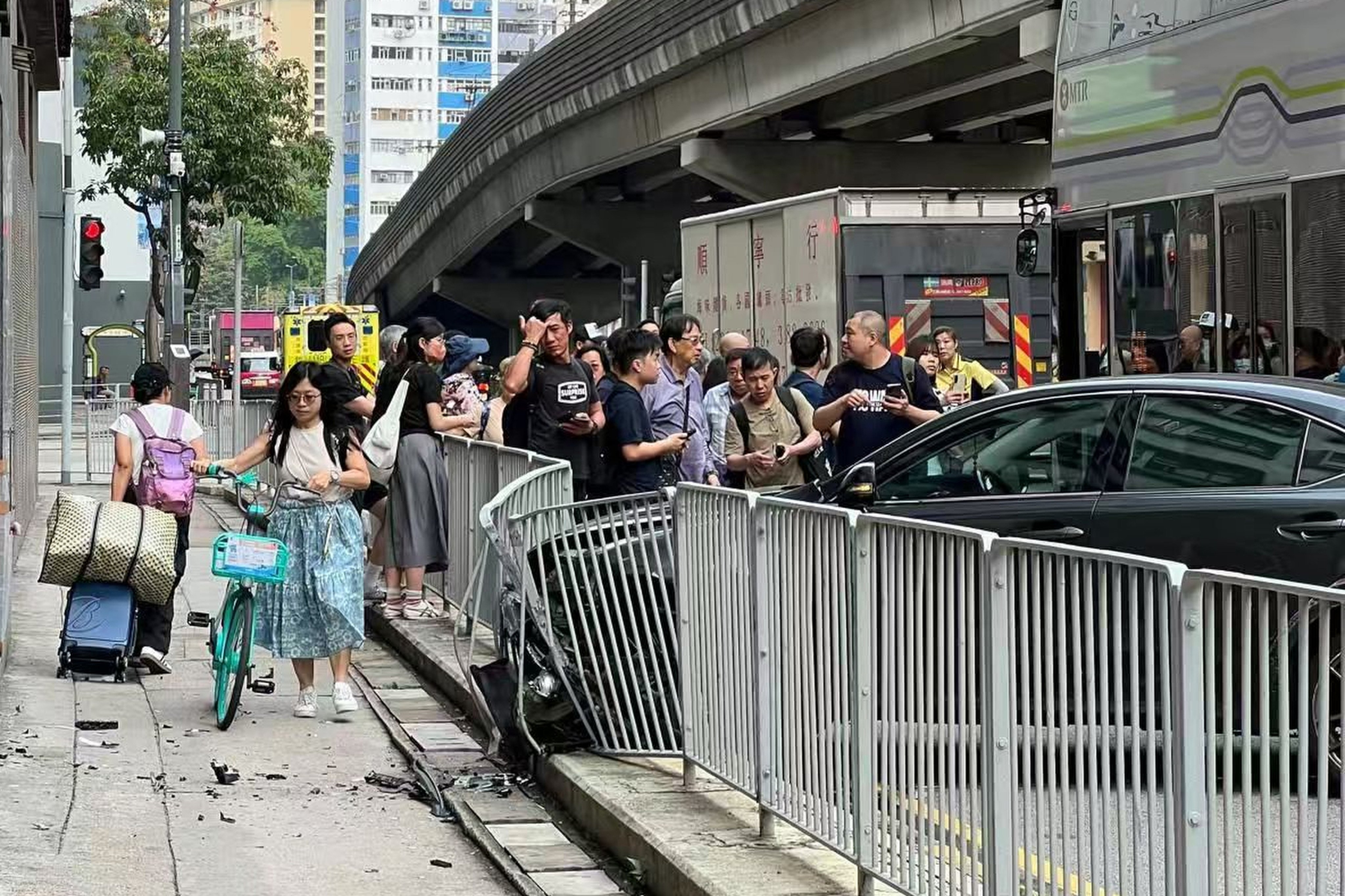 The front of the car wedged into the barricade after crashing in Tuen Mun on Saturday morning. Photo: Handout