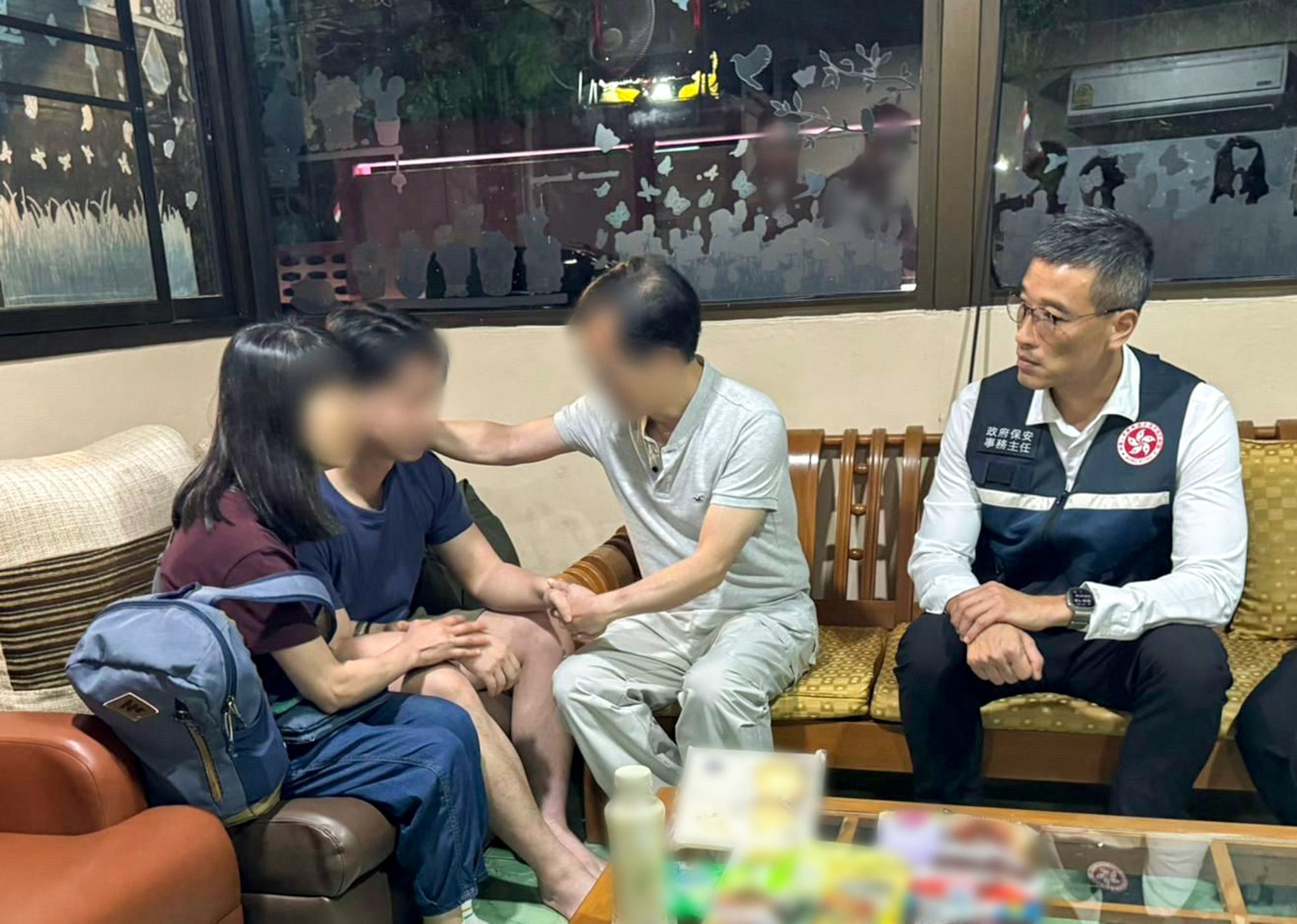 The man is reunited with his family. Photo: Security Bureau