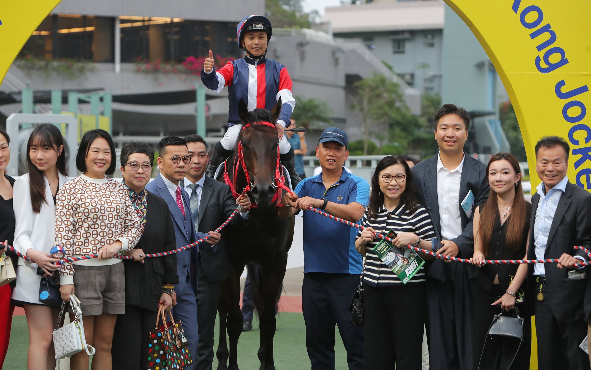 Connections of Salon S celebrate his latest Sha Tin success. Connections of Salon S celebrate his latest Sha Tin success.