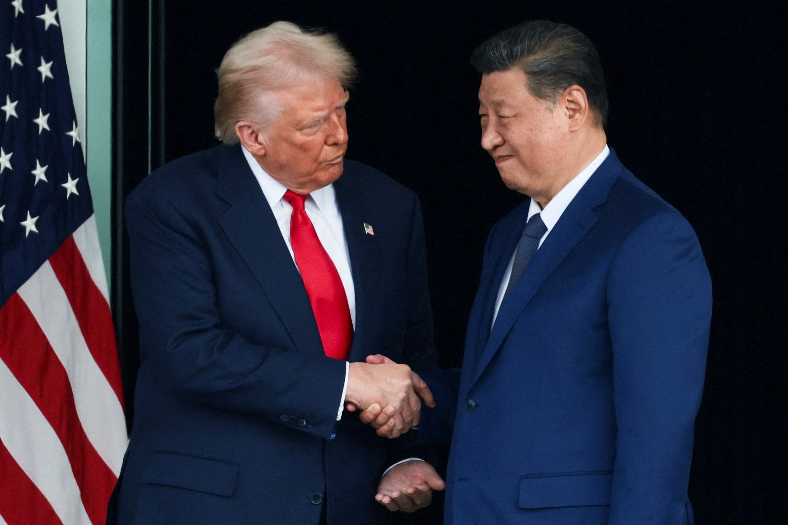 U.S. President Donald Trump and Chinese President Xi Jinping talk as they leave a bilateral meeting at Gimhae International Airport, on the sidelines of the APEC summit in Busan, South Korea, on October 30. Photo: Reuters/File Photo