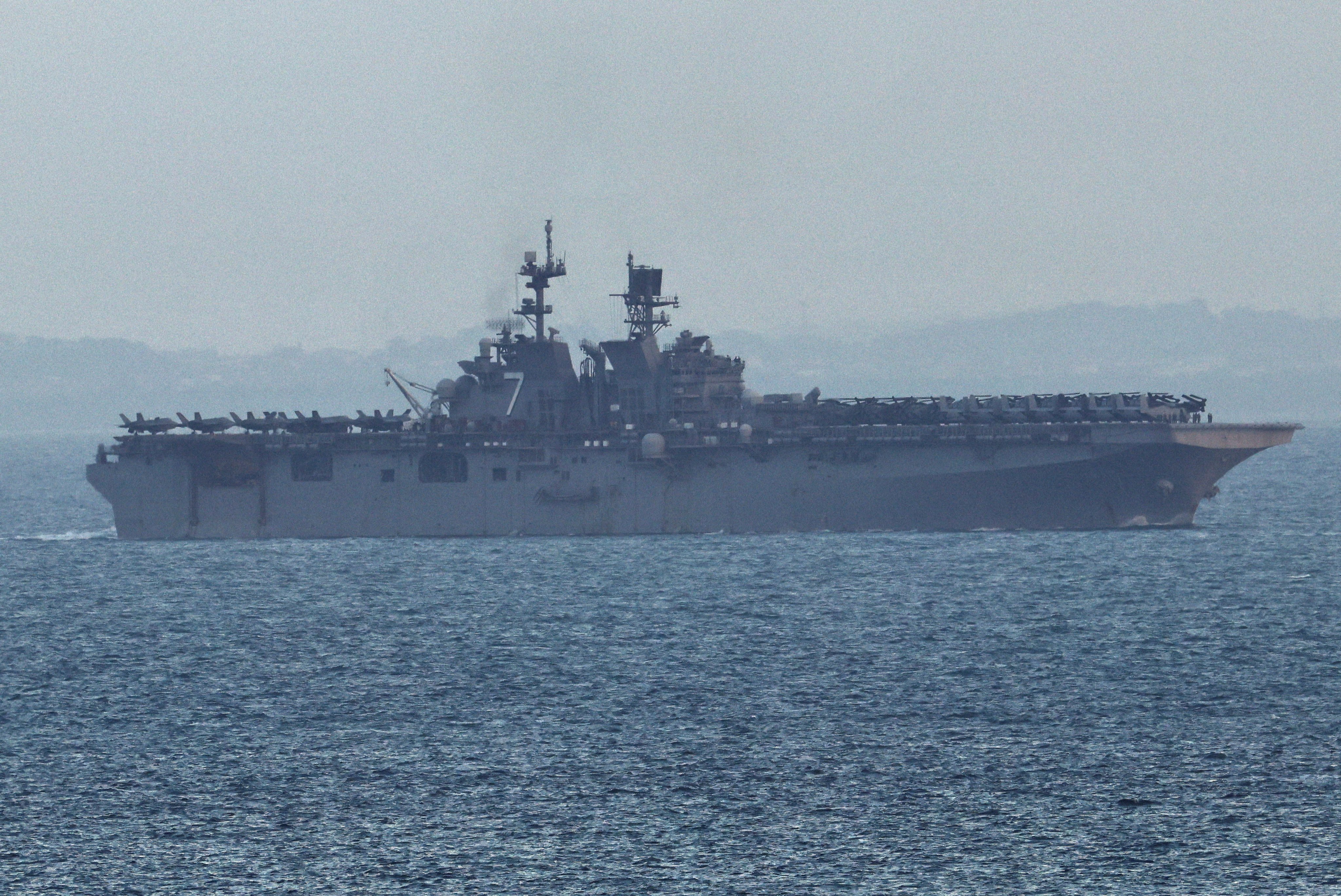 The USS Tripoli enters the Singapore Strait on March 17. Photo: Reuters