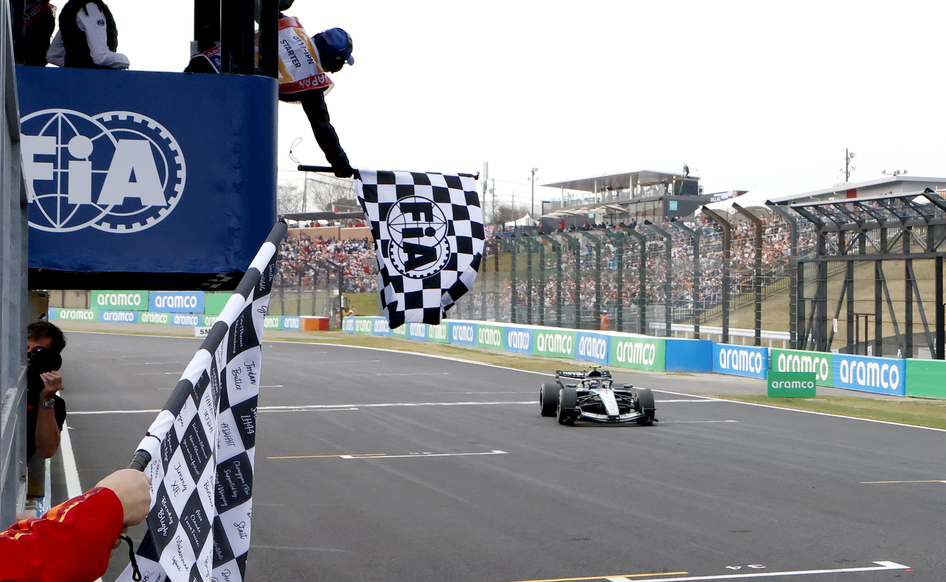 Kimi Antonelli of Italy drives past the chequered flag to win the Formula 1 Japanese Grand Prix at the Suzuka International Racing Course on Sunday. Photo: EPA