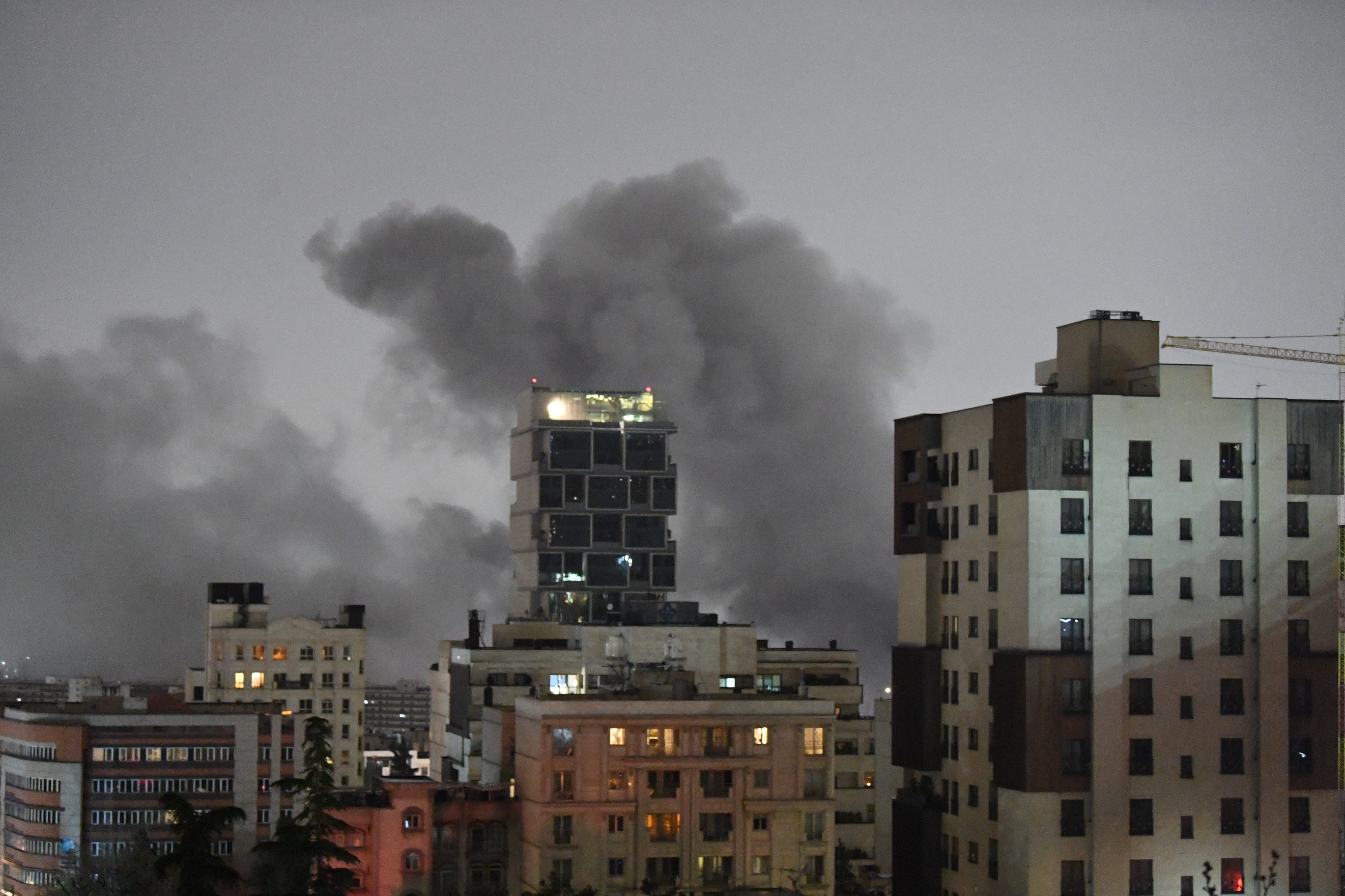 A plume of smoke rises from the site of a strike in Tehran, Iran, on Saturday. Photo: Xinhua