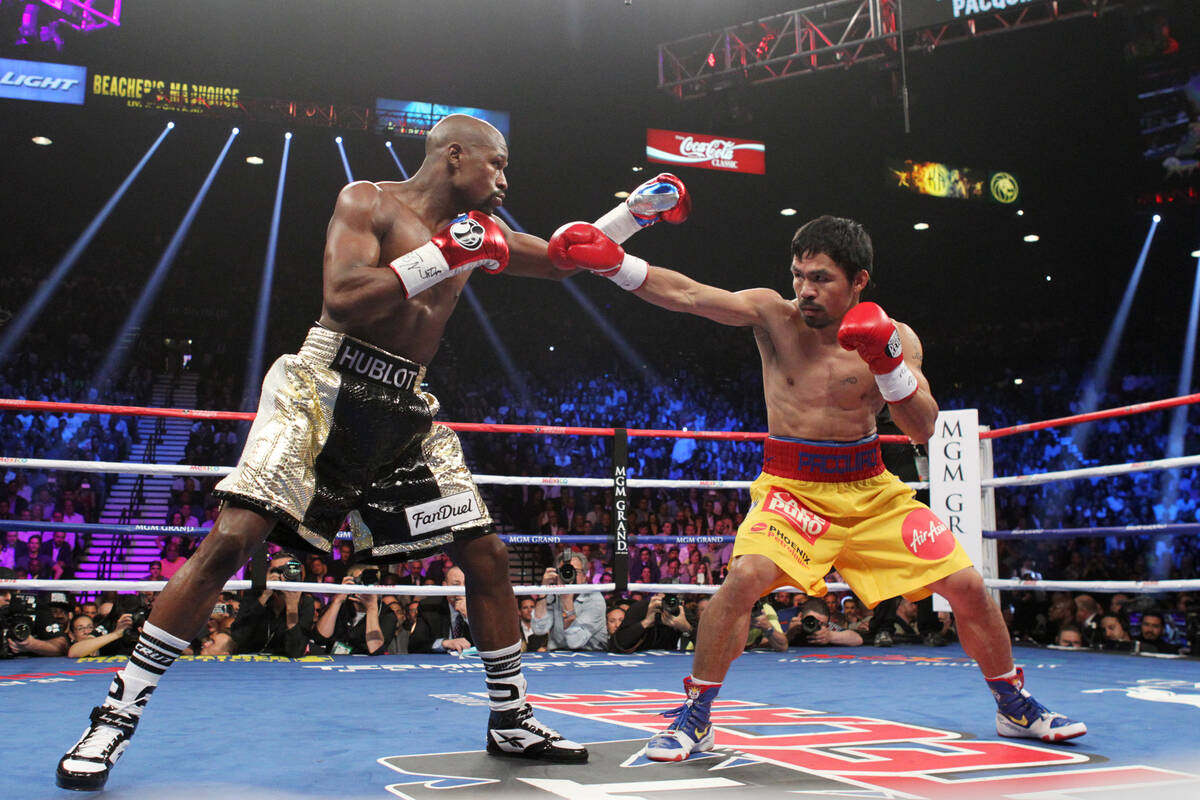 Floyd Mayweather Jnr (left) beat Manny Pacquiao in their welterweight boxing match at the MGM Grand Garden Arena in Las Vegas in 2015 that promoters said was the most profitable fight in history, setting  pay-per-view records. Photo: TNS