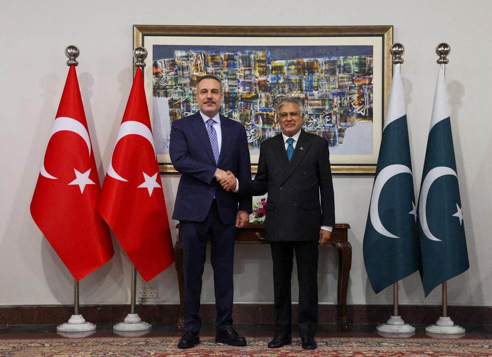 Turkish Foreign Minister Hakan Fidan (left) meets with Pakistani Foreign Minister Ishaq Dar, as Pakistan hosts talks with the foreign ministers of Saudi Arabia, Egypt and Turkey to discuss regional de-escalation amid the US-Israel conflict with Iran, in Islamabad, Pakistan, on Sunday. Photo: Reuters