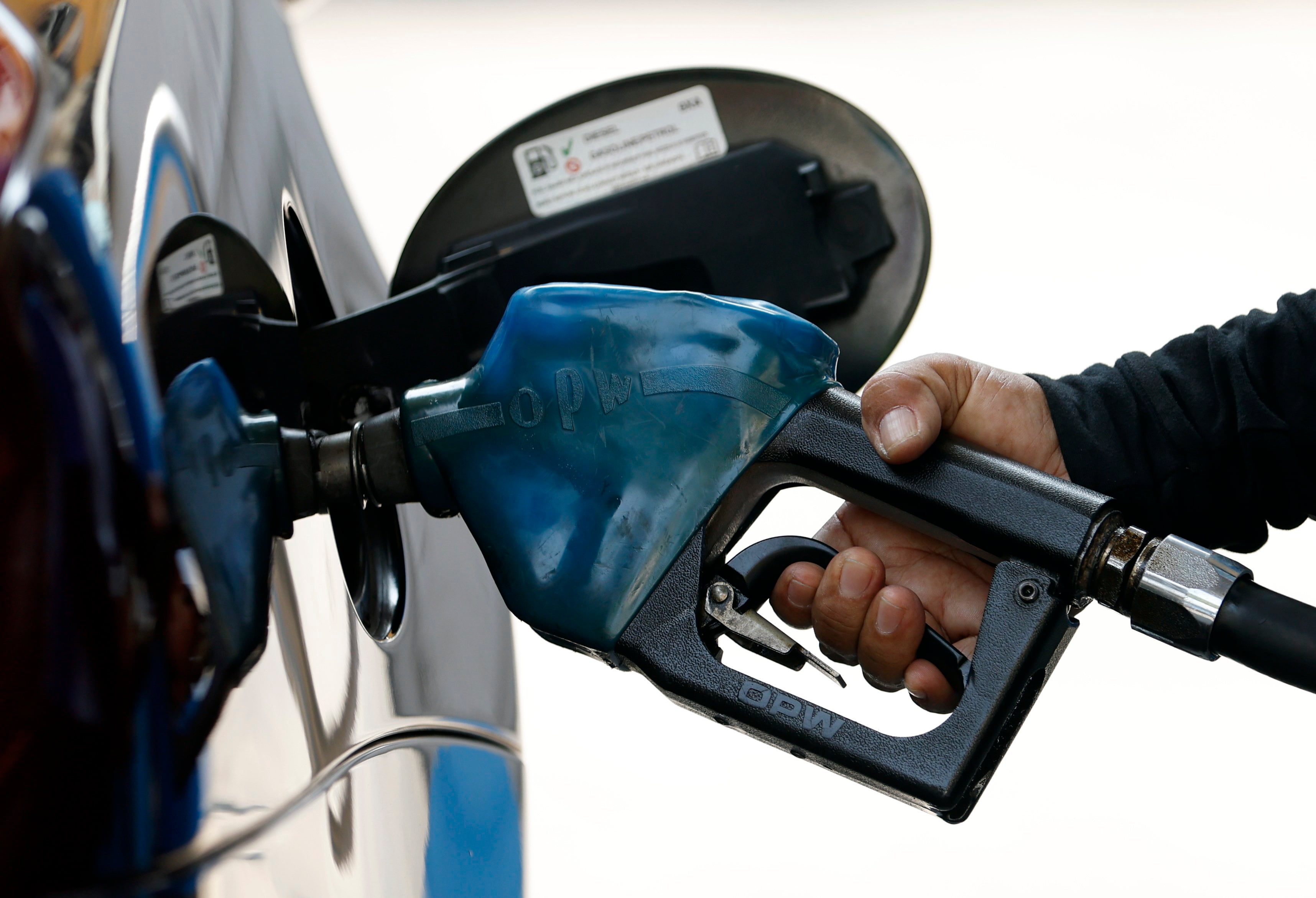 A worker pumps fuel into a car at a petrol station in Bangkok, Thailand, on Thursday. Photo: EPA