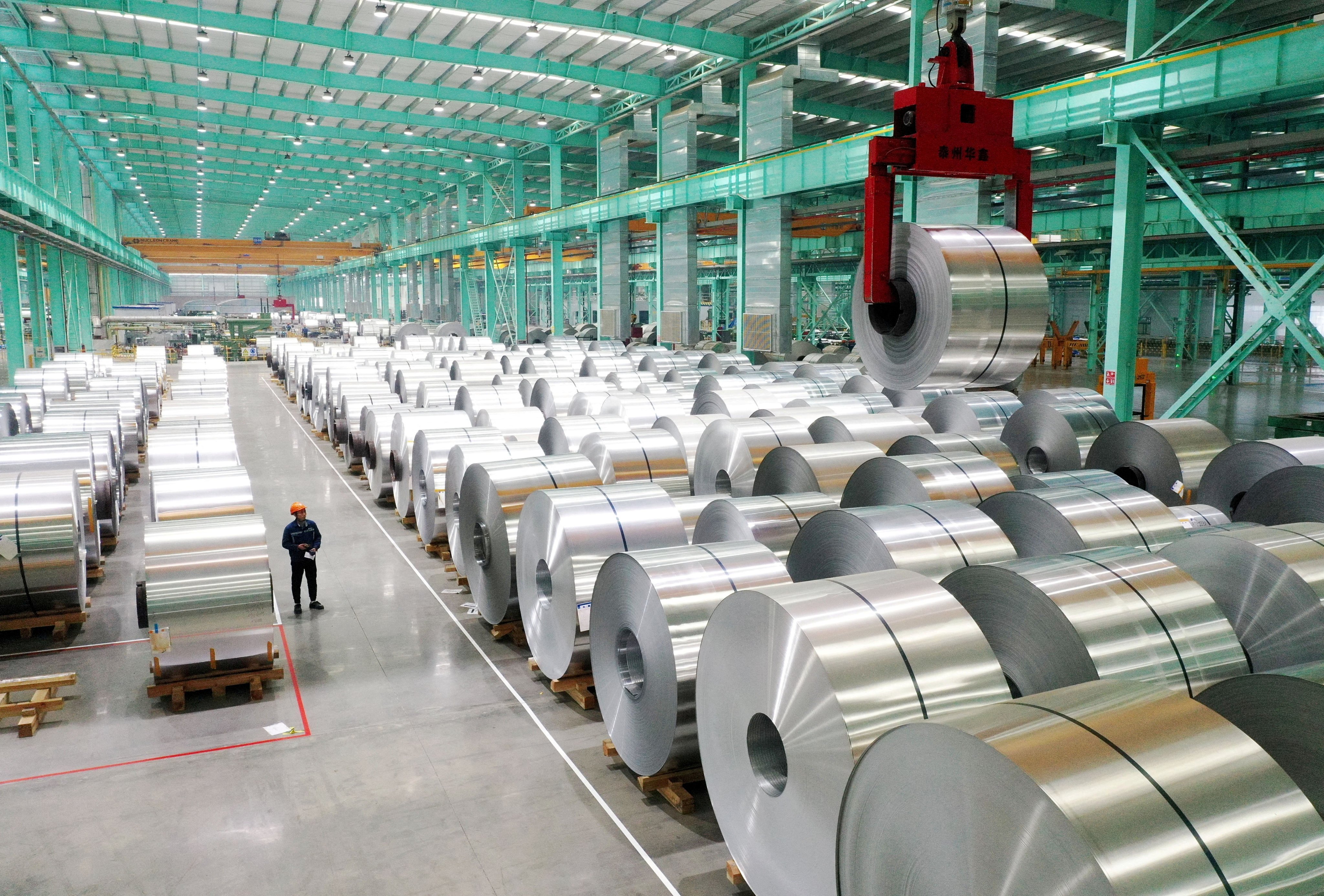 A drone view shows an employee working on the production line of aluminium products at a factory in Huaibei, Anhui province, China, in February 2025. Photo: Reuters