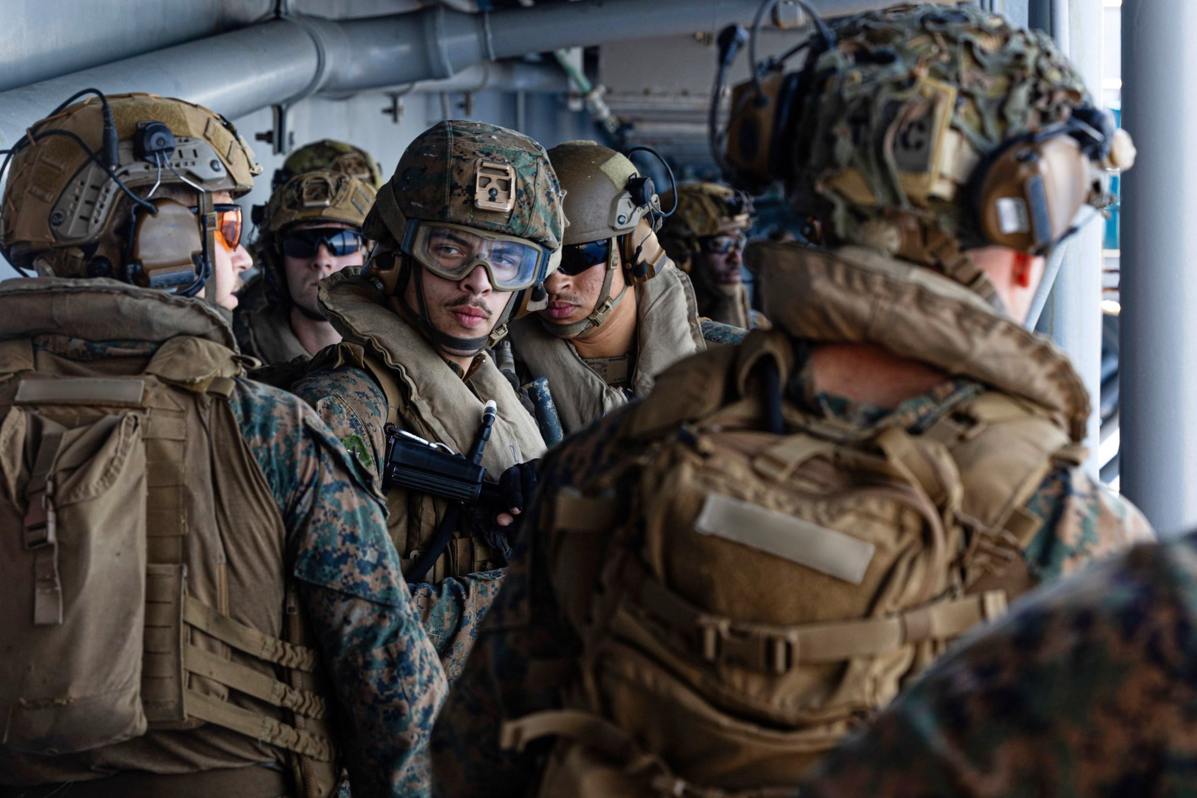 US sailors and marines aboard the USS Tripoli at an unspecified location in the Middle East on Friday. Photo: US Central Command via AP