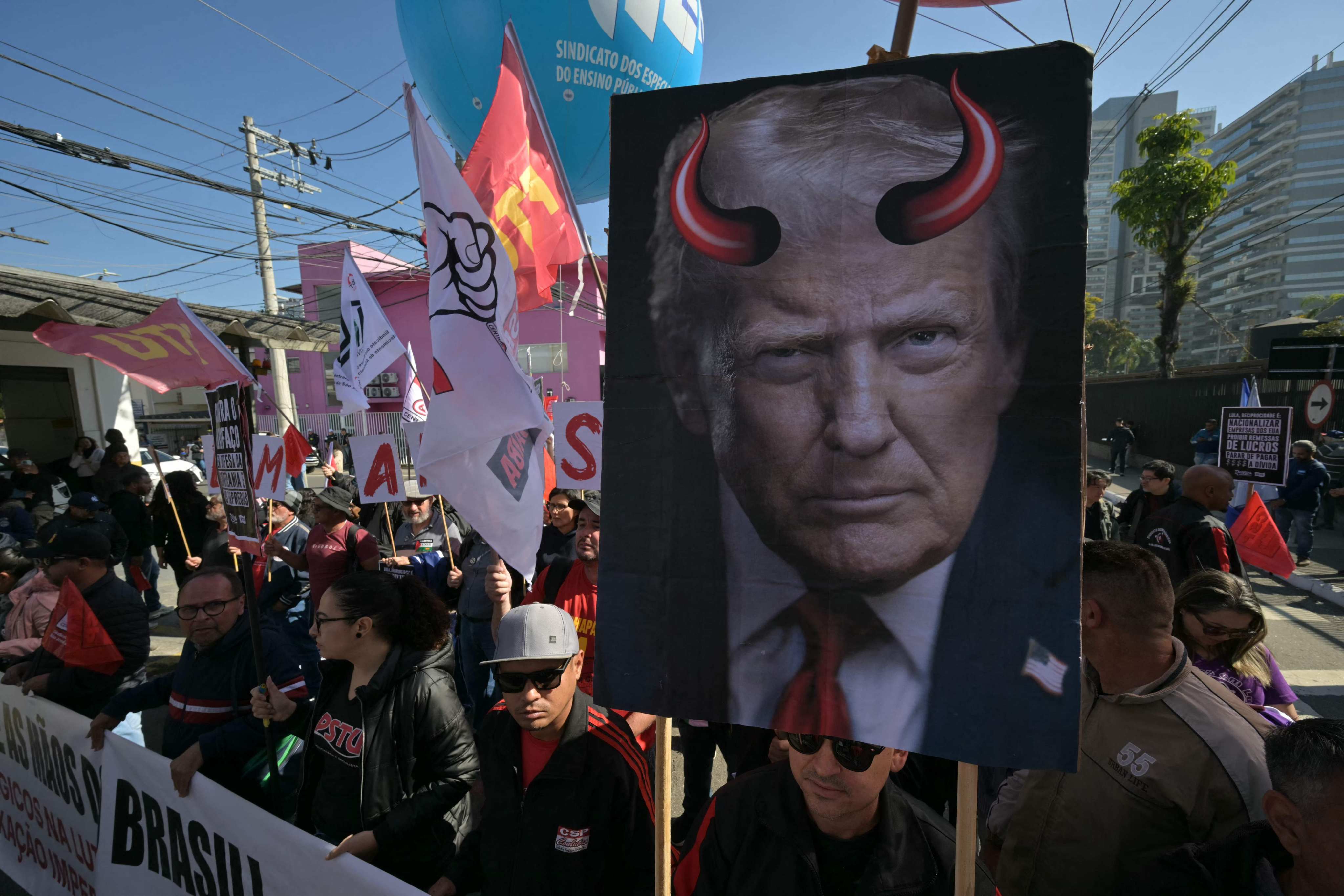 A poster depicting US President Donald Trump with devil horns at a protest in defence of national sovereignty near the US consulate in Sao Paulo, Brazil, on August 1, 2025. Photo: AFP