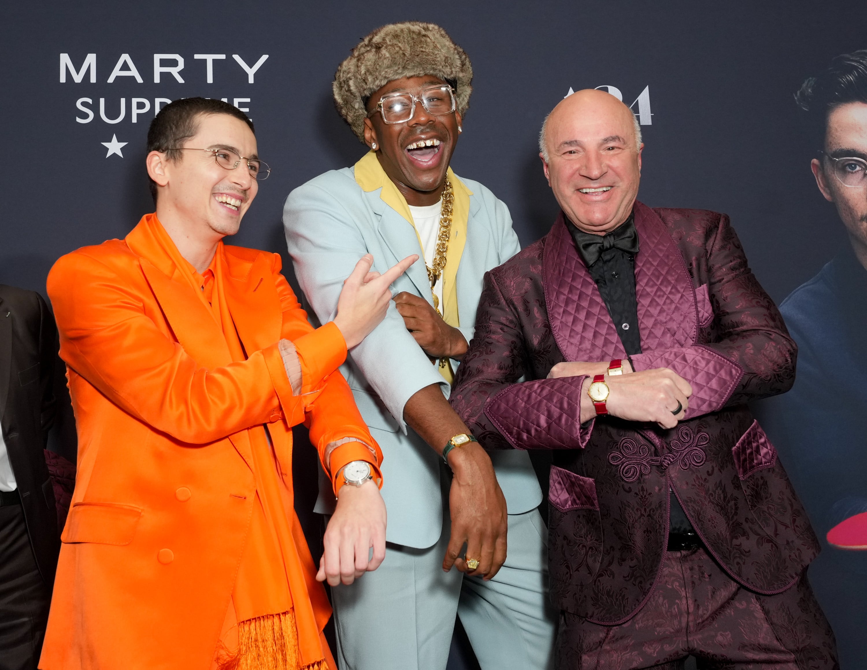 Timothée Chalamet, Tyler the Creator and Canadian businessman Kevin O’Leary show off watches with coloured straps at December’s New York premiere of Marty Supreme. Photo: Variety via Getty Images