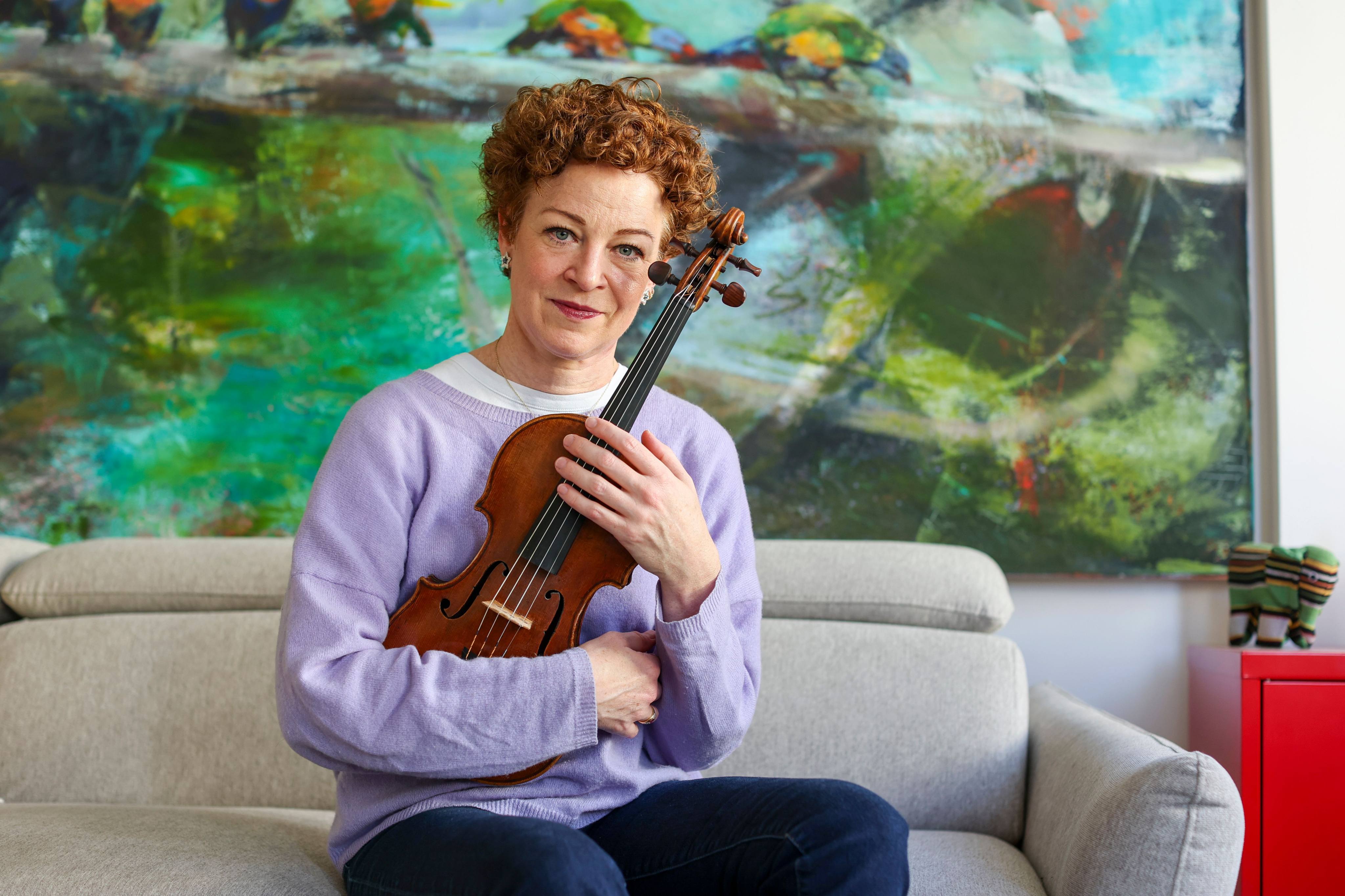 Musician Carolin Widmann had to cradle her violin like a baby on a Lufthansa flight. She wrote to the company’s CEO and the rules were changed. Photo: Jan Woitas/dpa