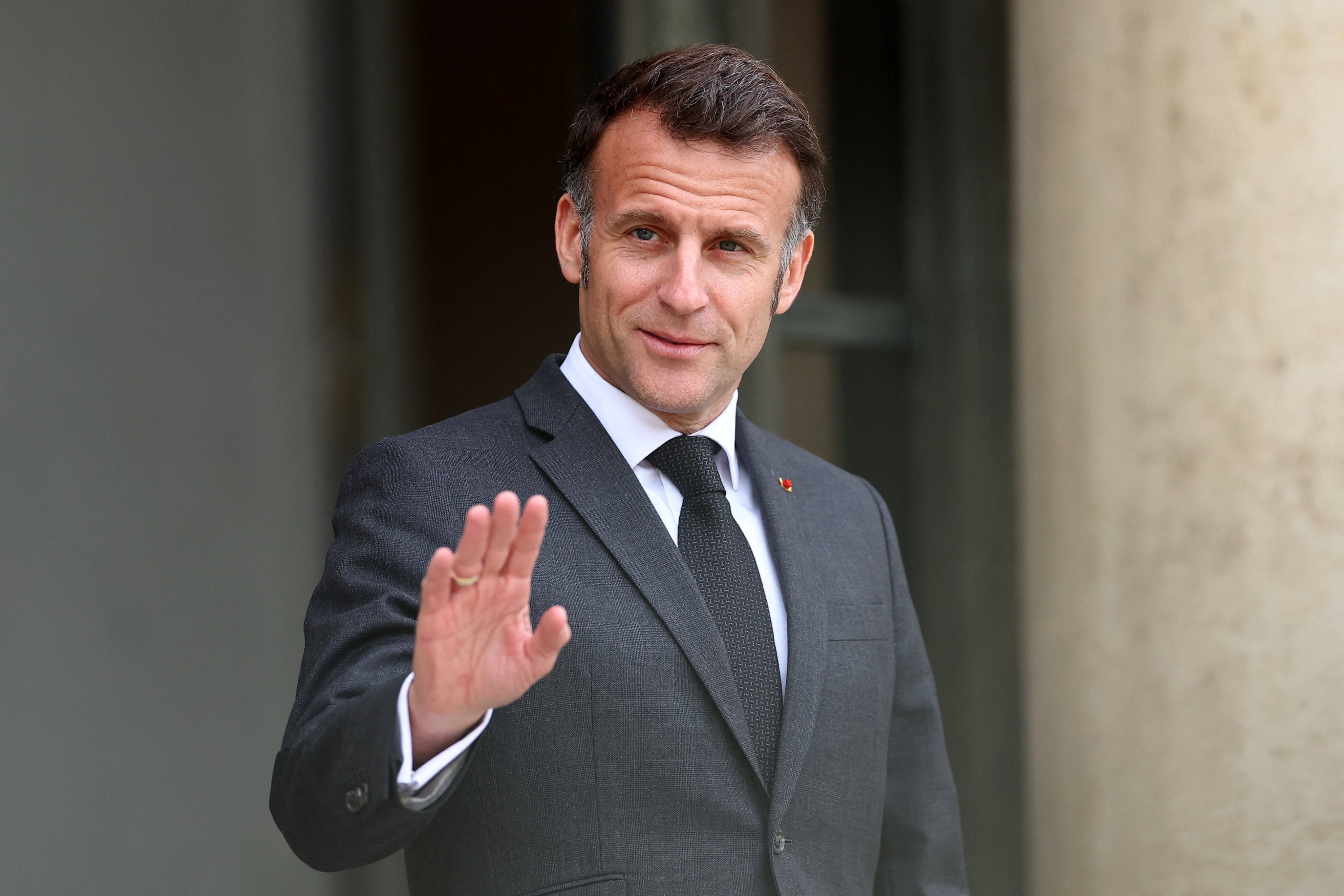 French President Emmanuel Macron waves to journalists in Paris last week. Photo: Reuters