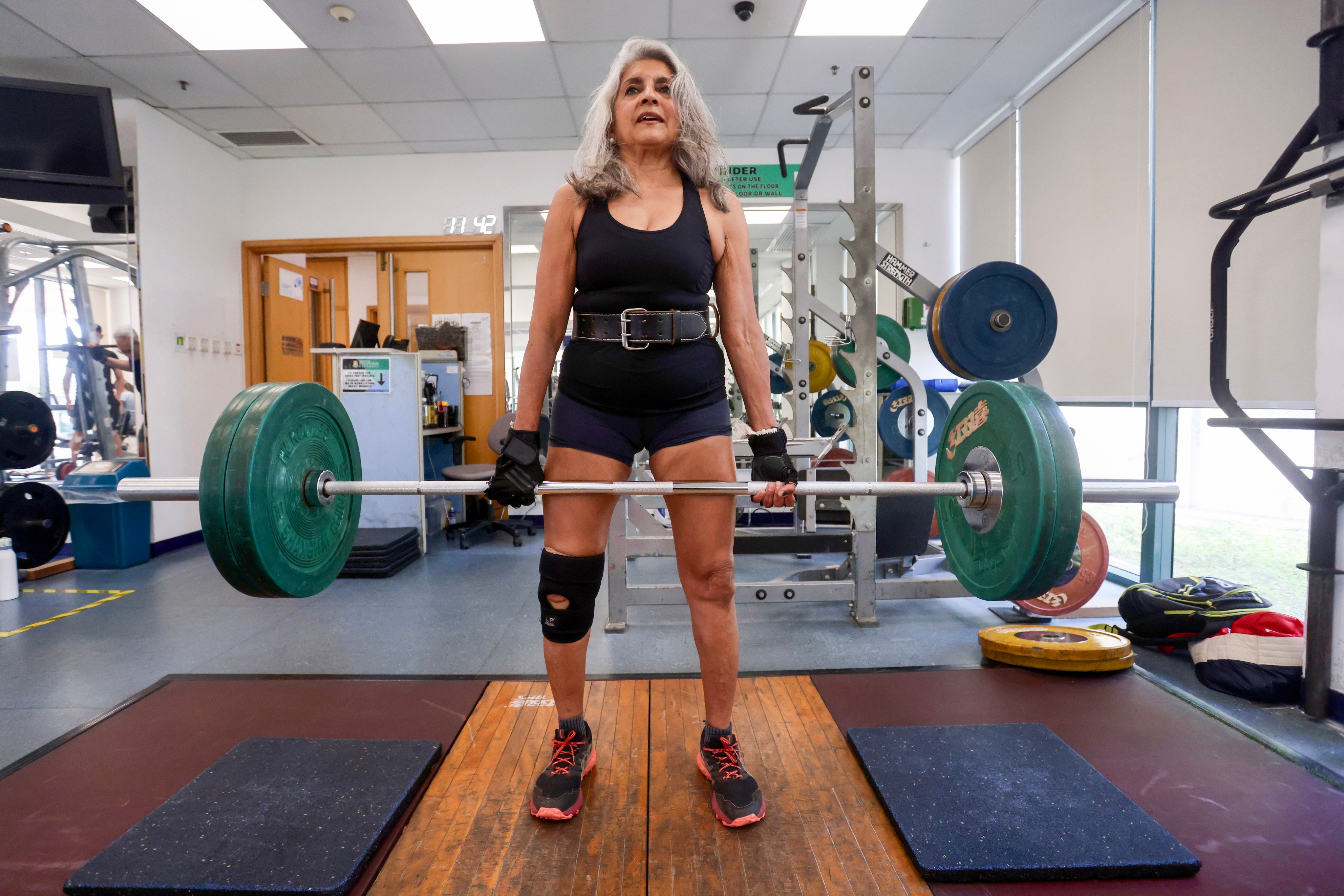 Anjali Hazari, a former marathoner and mountaineer, trains at the Stanley Ho Sports Centre complex in Pok Fu Lam, Hong Kong, ahead of her first powerlifting competition. Photo: Jonathan Wong