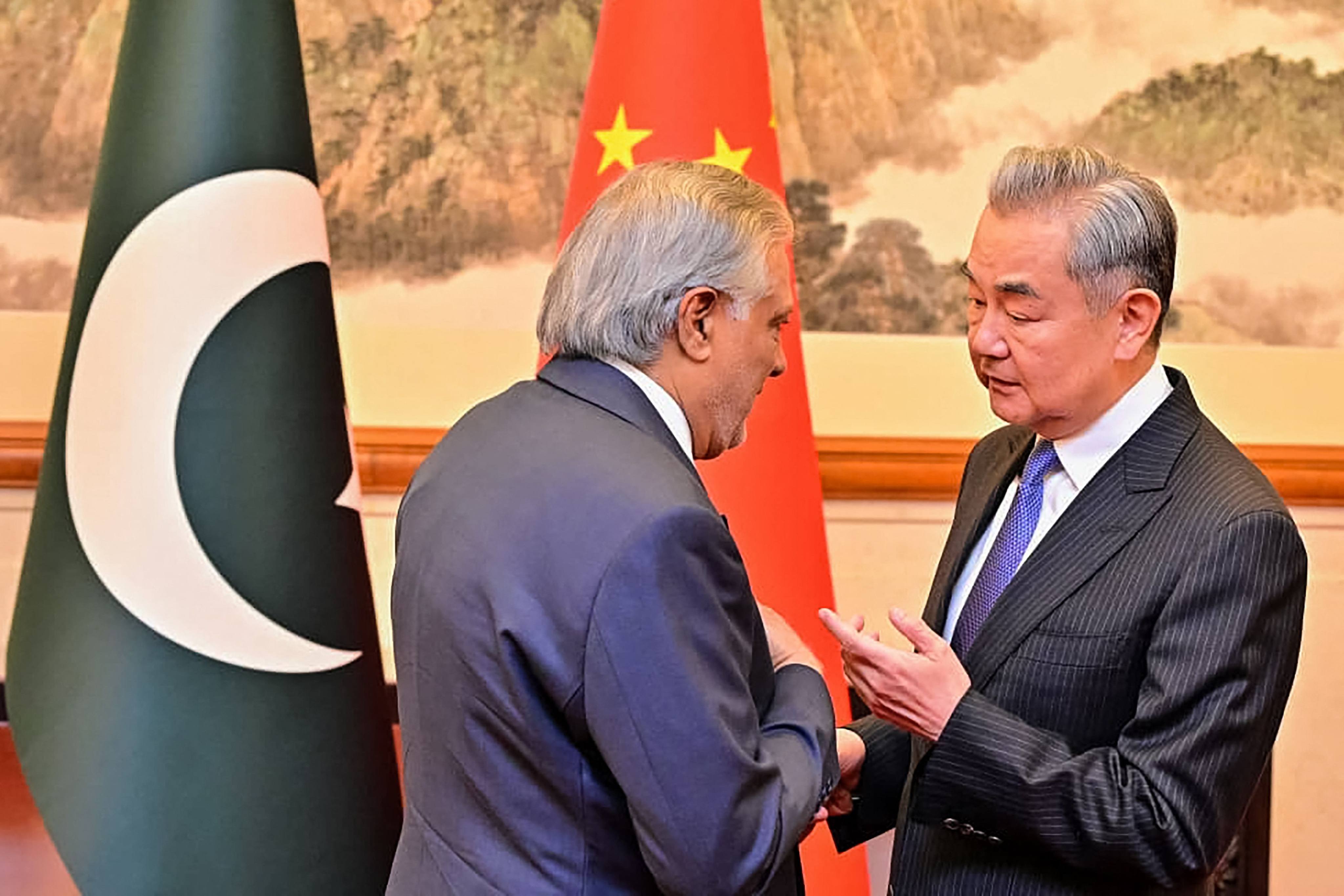 Pakistani Foreign Minister Ishaq Dar (left) meets his Chinese counterpart Wang Yi in Beijing on January 4. Photo: AFP
