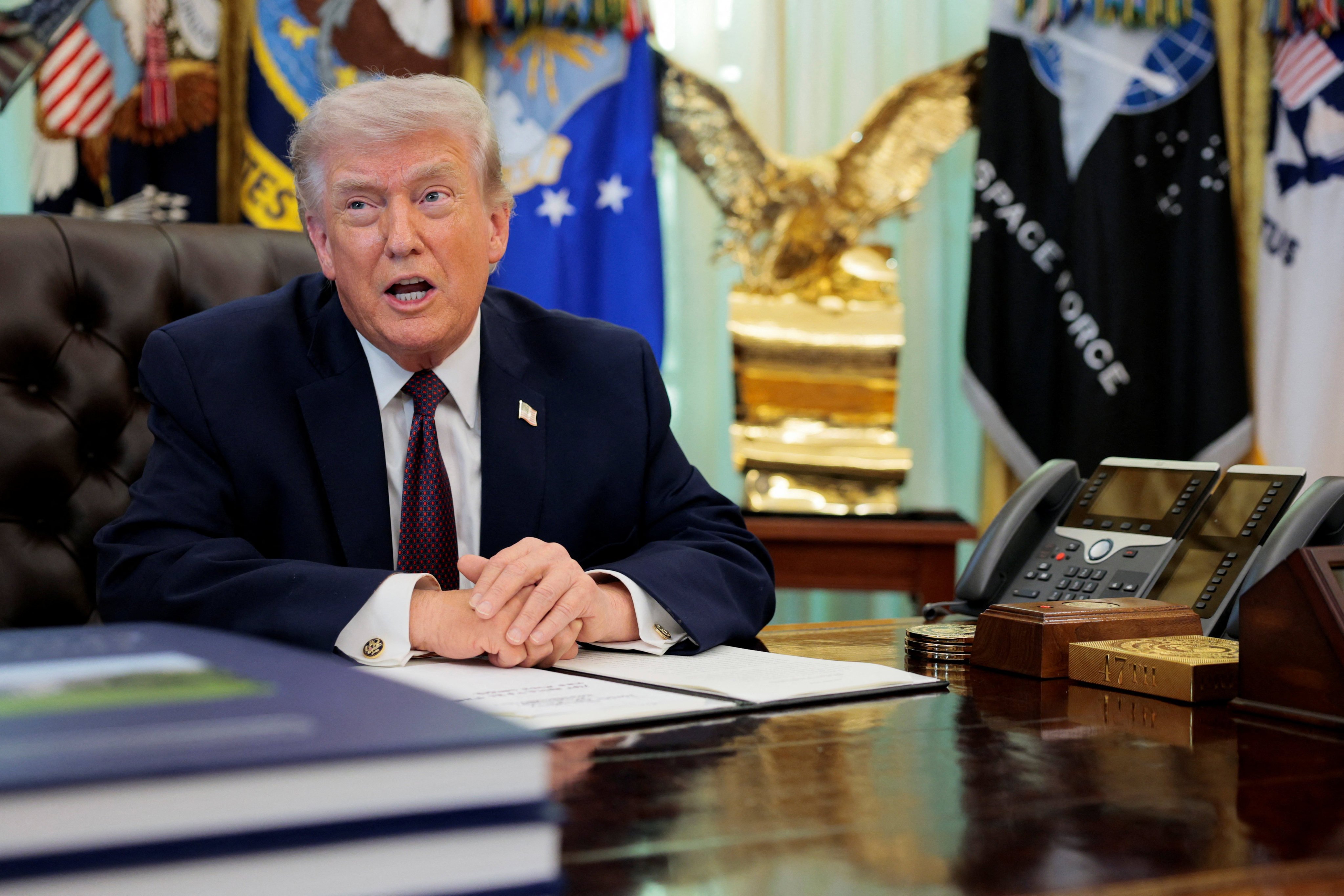 U.S. President Donald Trump speaks on the day he signs an executive order in the Oval Office of the White House in Washington, D.C., March 31, 2026.  REUTERS/Evan Vucci