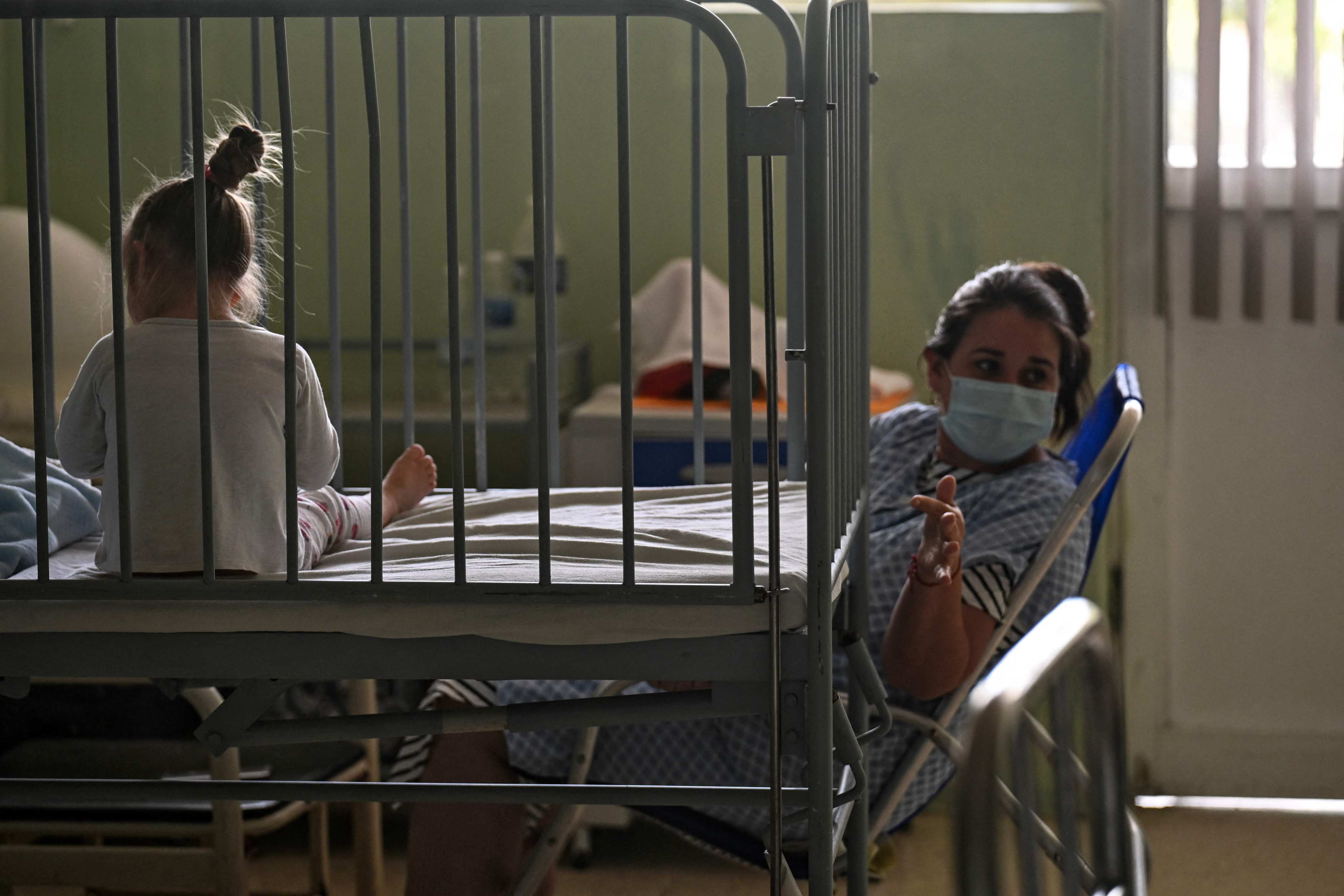 A woman cares for her daughter at the William Soler Paediatric Hospital in Havana on March 24, 2026. Photo: AFP