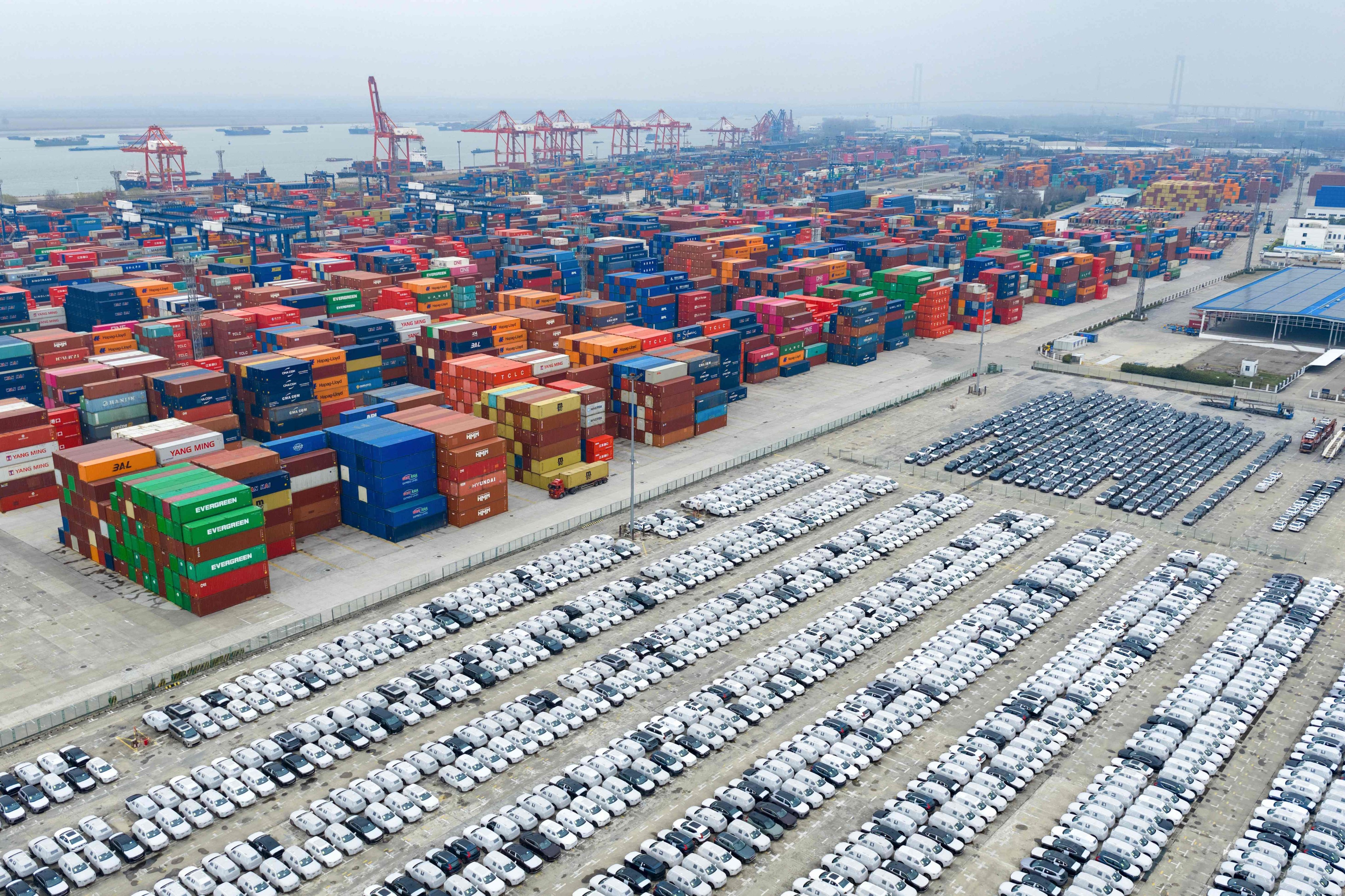 Large numbers of cars and containers are stacked at a port waiting for export in China’s eastern Jiangsu province. Photo: AFP