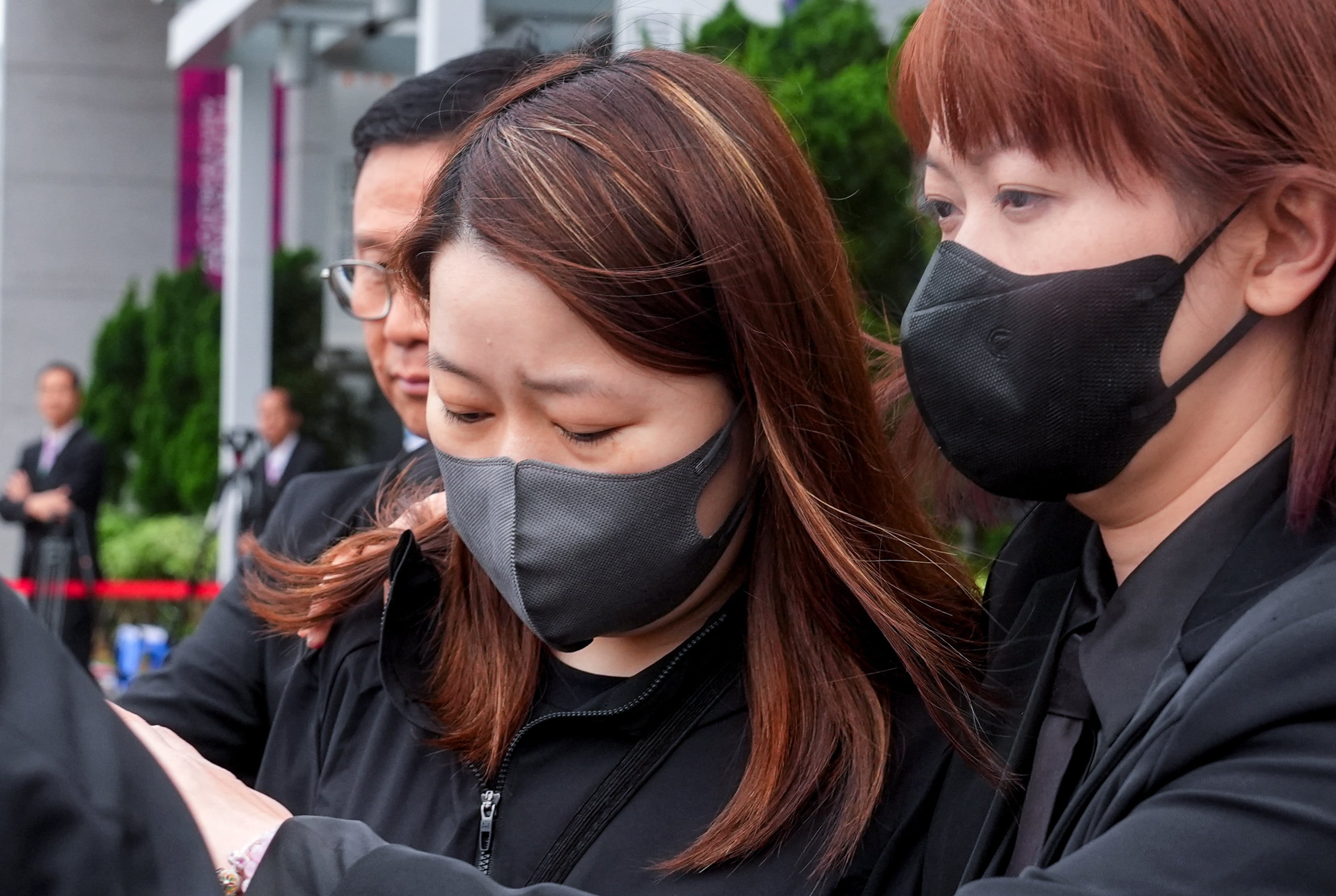 ISS property officer Cheng Tsz-ying (centre) leaves the hearing on Thursday. Photo: Elson Li